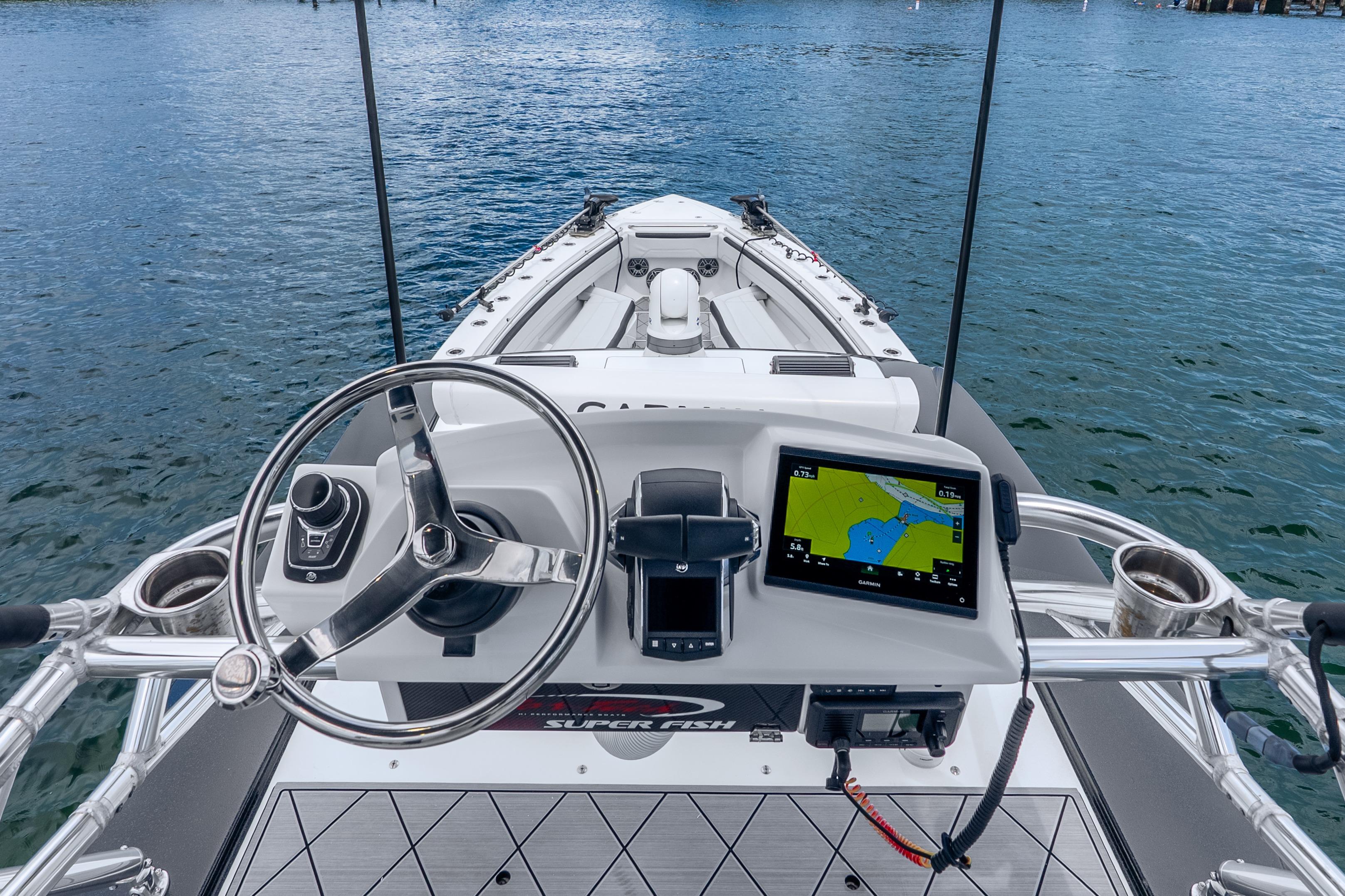 2024 Nor-Tech 452 Super Fish boat dashboard with navigation system on open water.