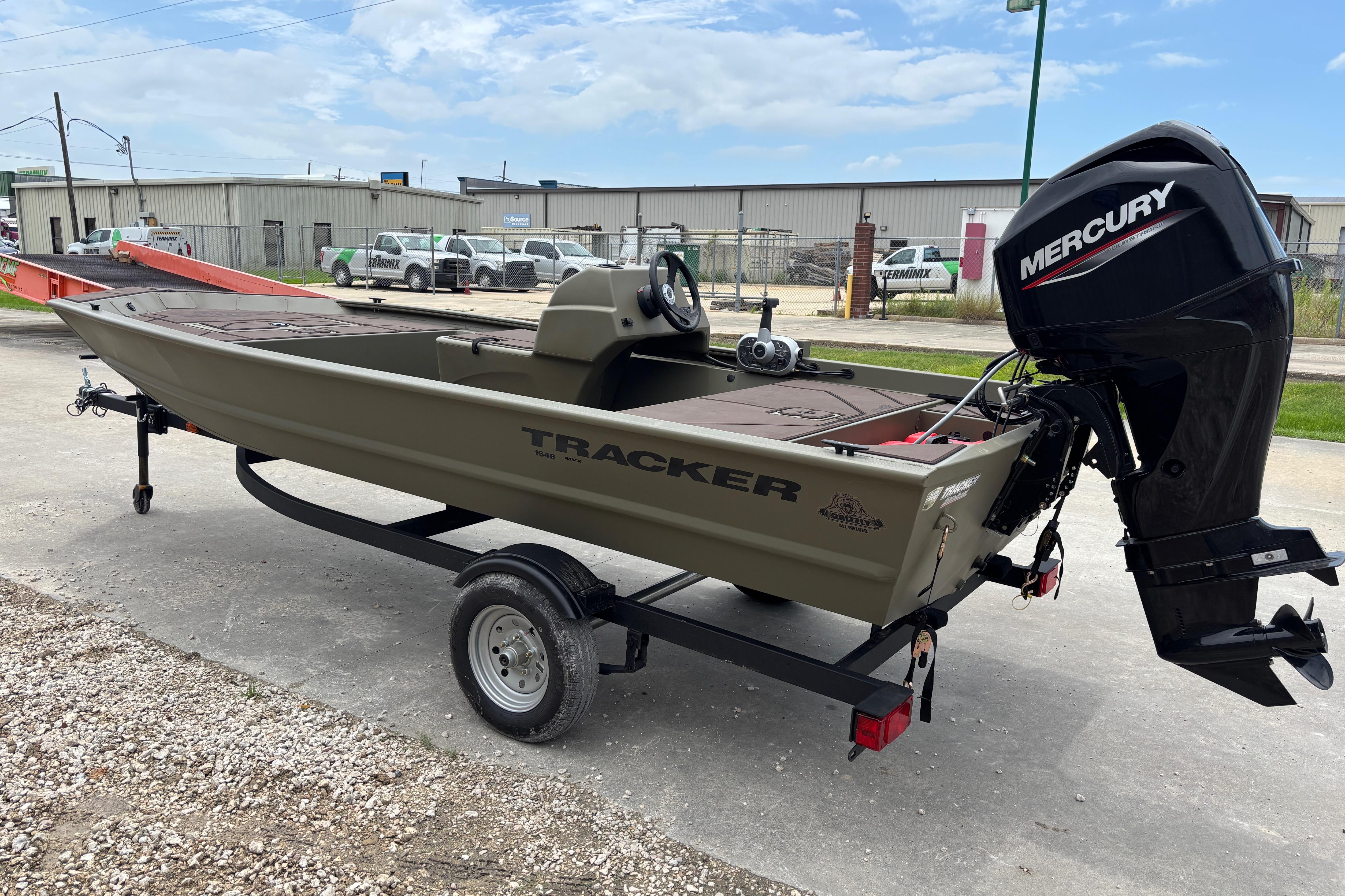 2026 Tracker Grizzly 1648 SC boat with Mercury outboard motor on trailer.