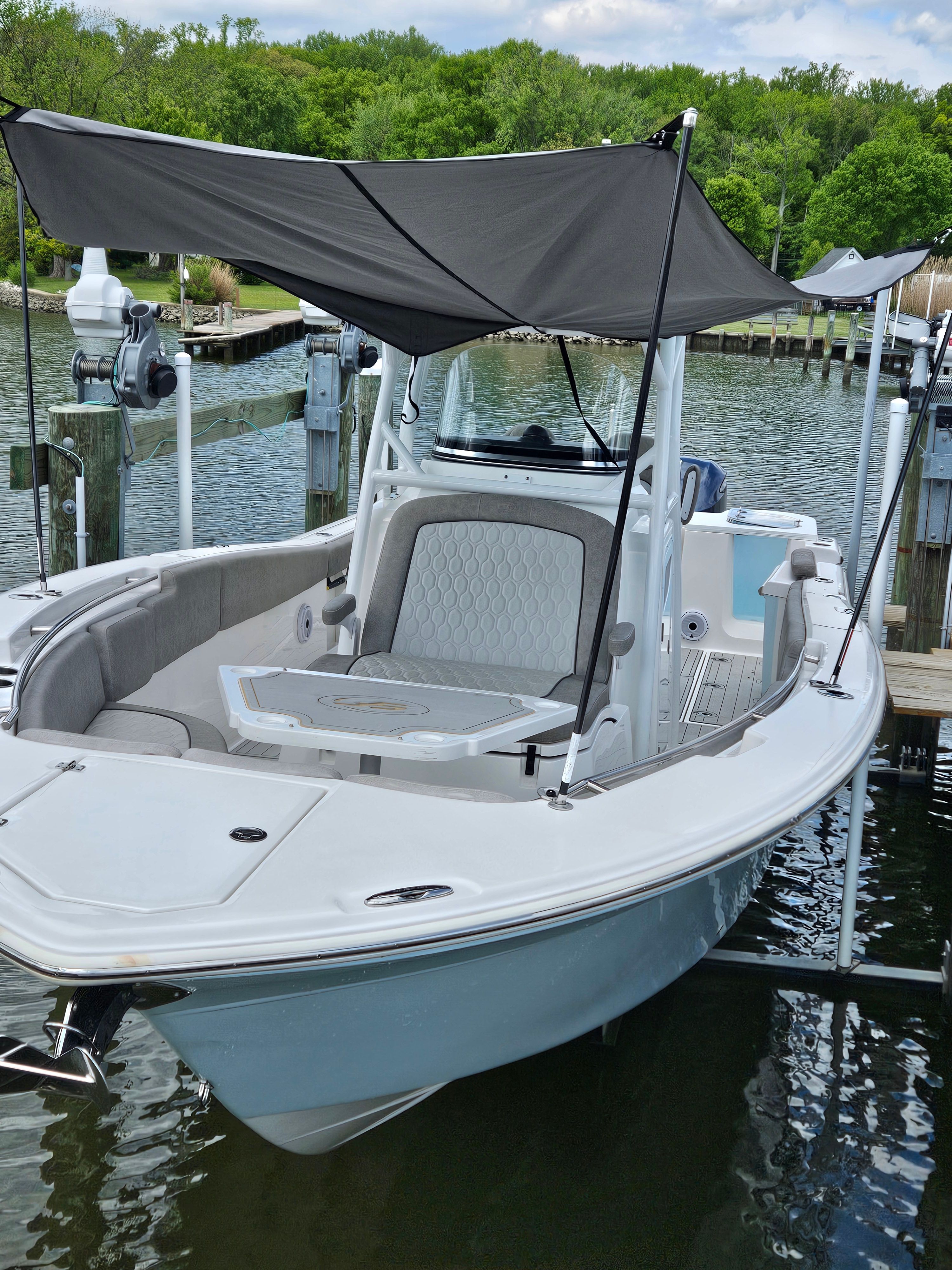 Sea Fox 288 Commander 2021 boat docked with sunshade.