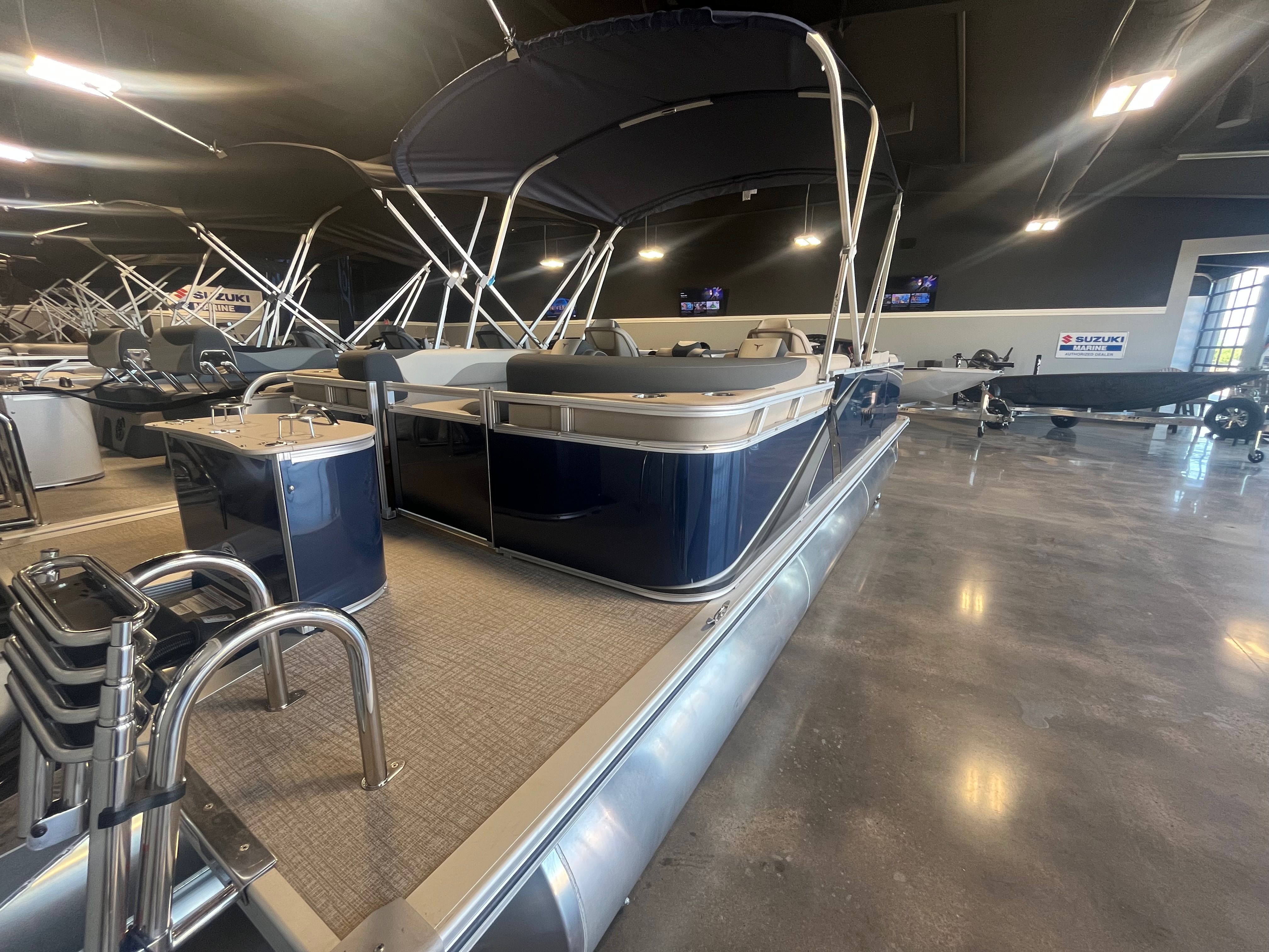 2025 Tahoe LTZ QL pontoon boat in showroom.