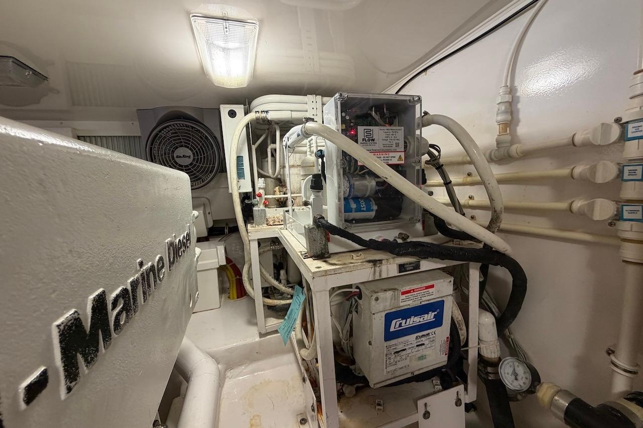 Engine room of 2012 Viking 50 Convertible yacht with marine diesel components.
