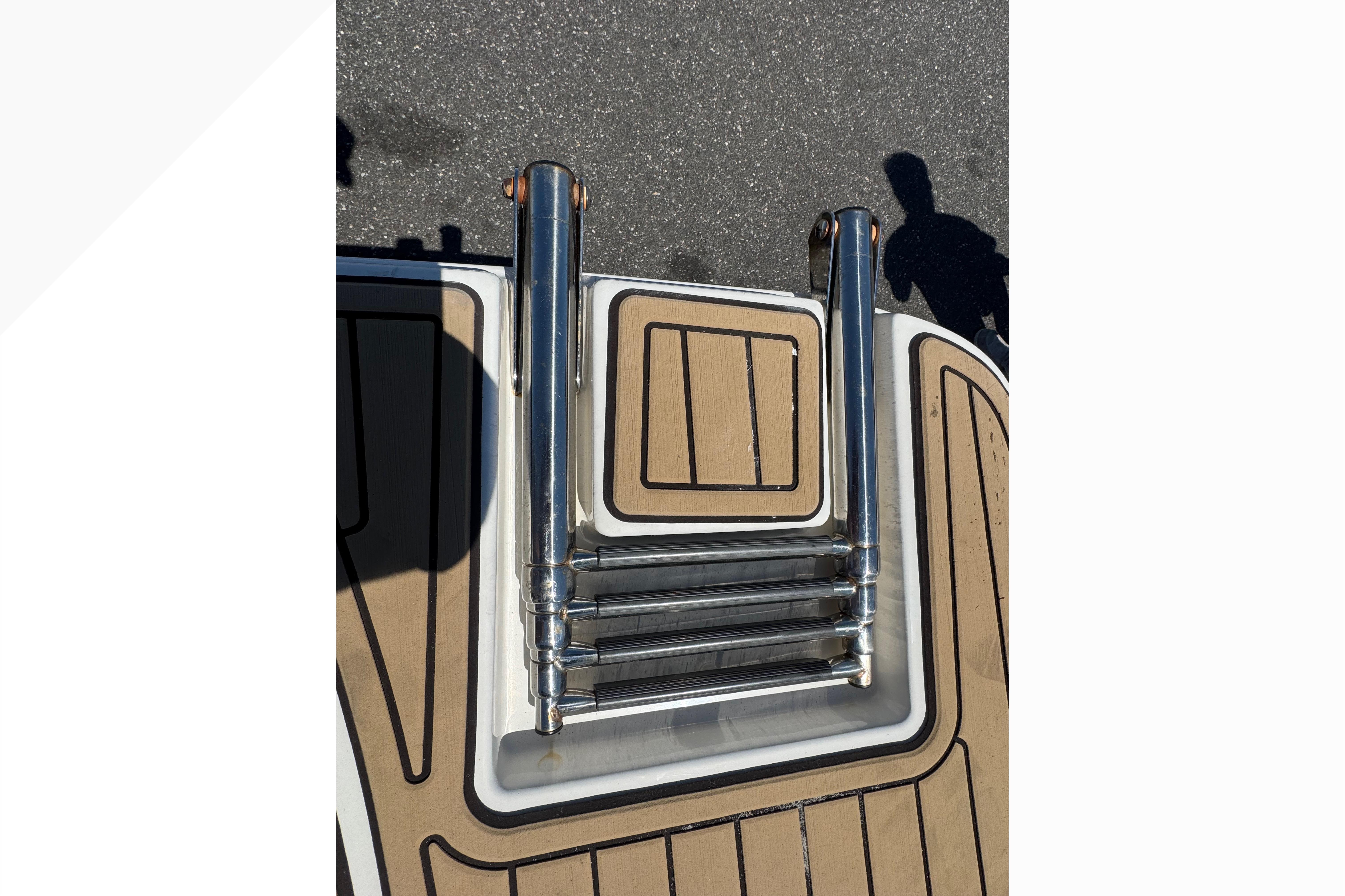 2021 Sea Ray SPX 190 boat ladder on deck, featuring stainless steel construction.