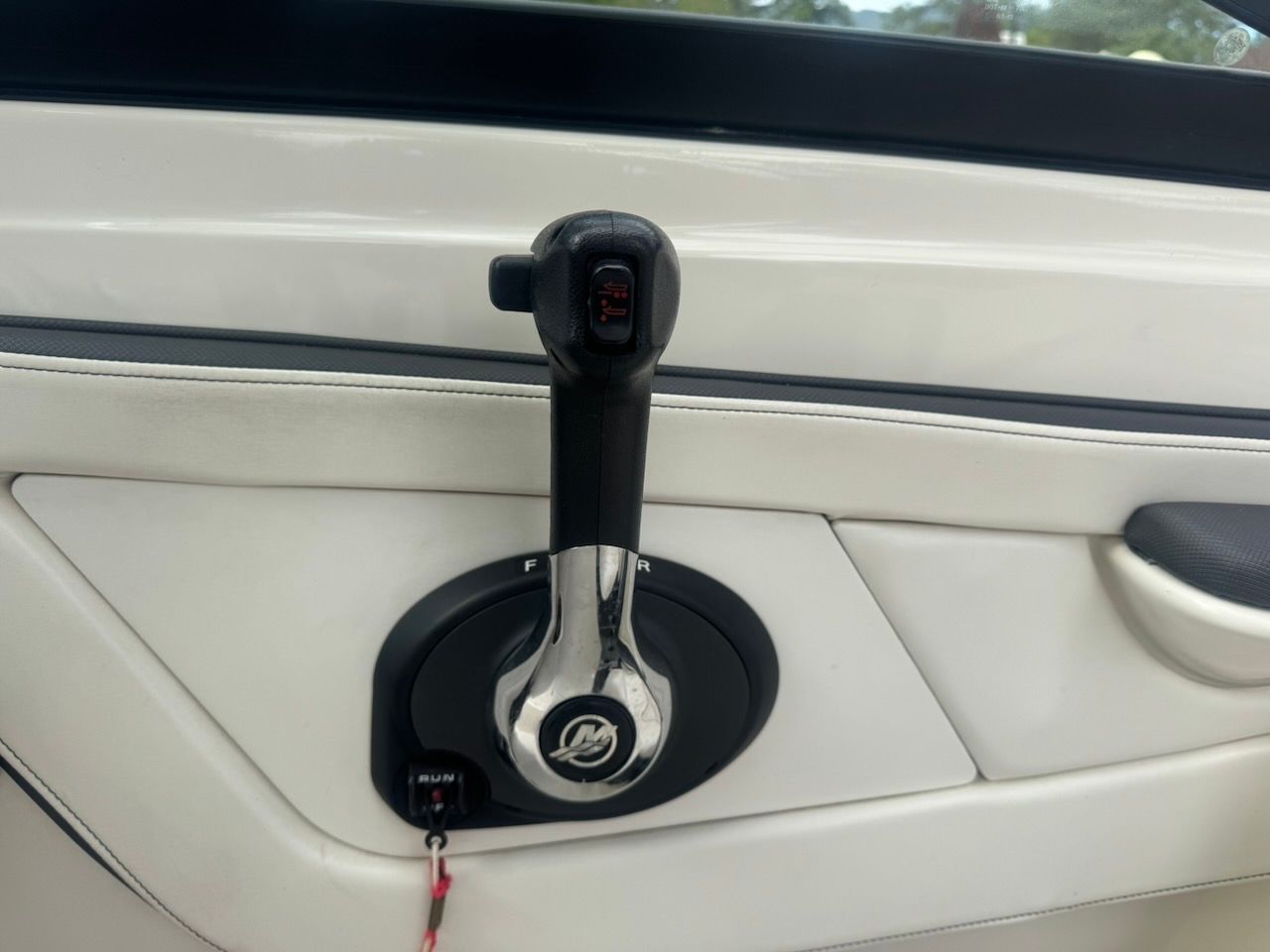 Close-up of a throttle lever in a Sea Ray SPX 190 Outboard boat.