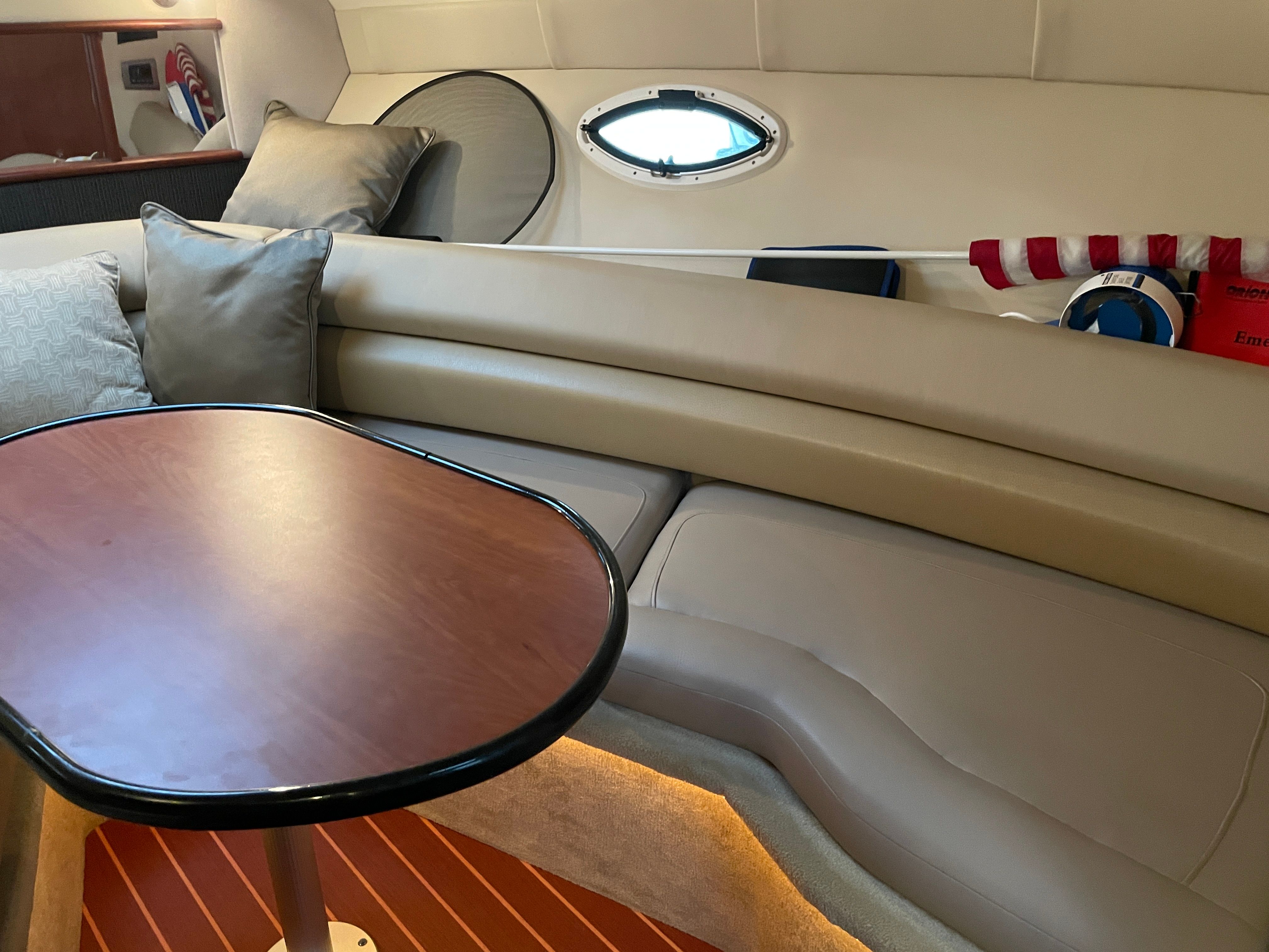 Interior of 2010 Monterey 280 Sport Cruiser with table and seating area.