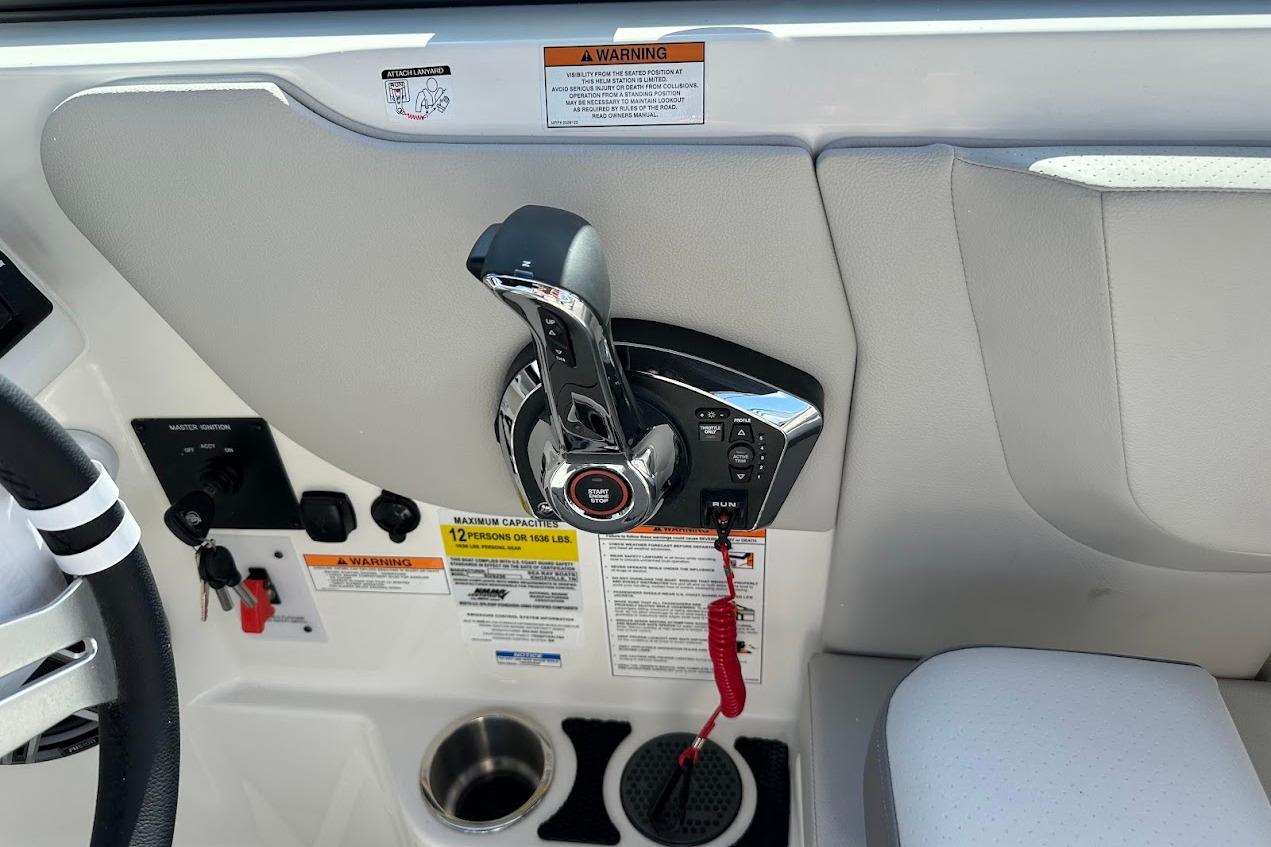 2026 Sea Ray SDX 230 Surf boat control panel with throttle and warning labels.