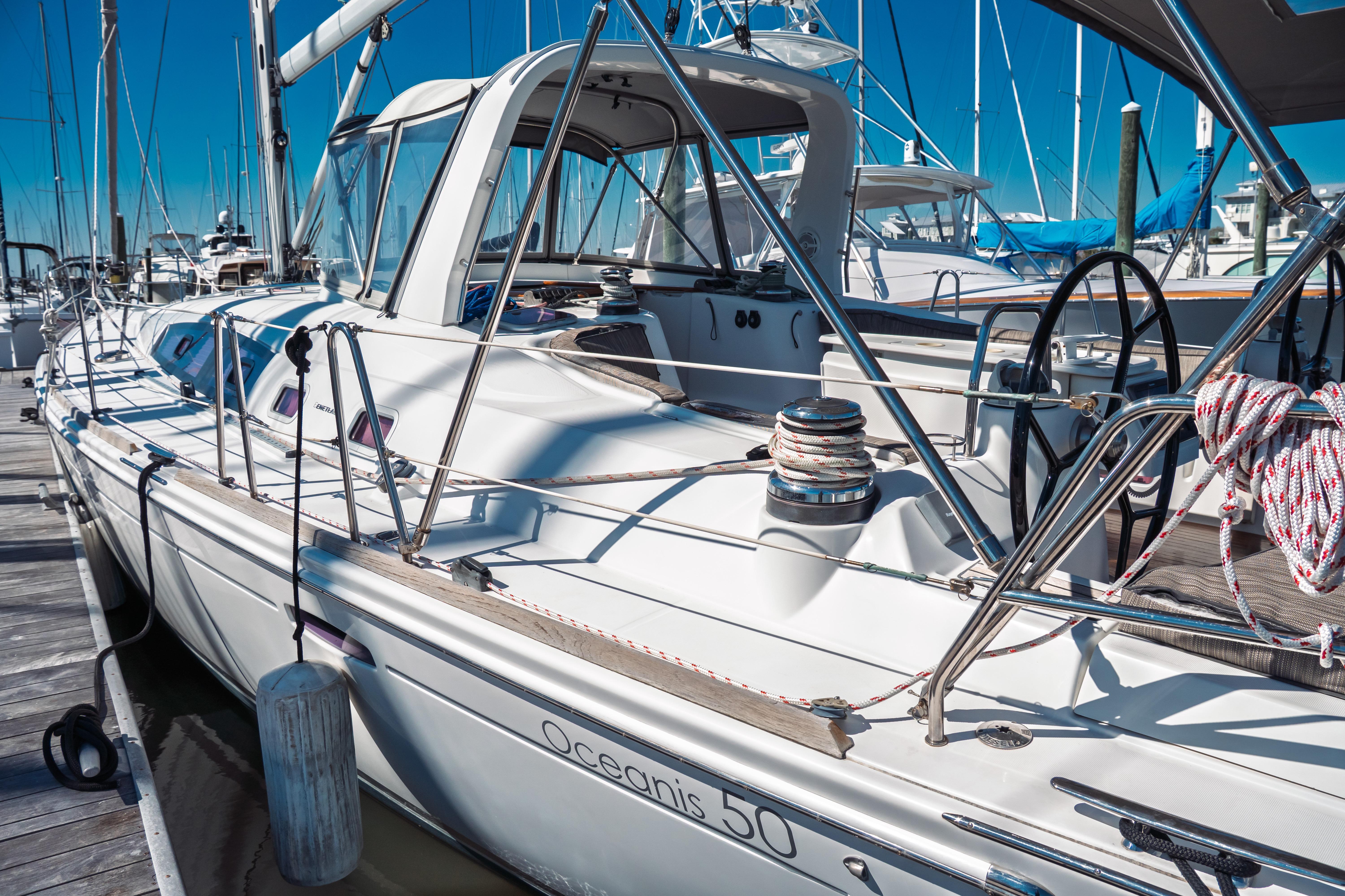 2011 Beneteau Oceanis 50 sailboat docked at marina, showcasing sleek design and rigging.