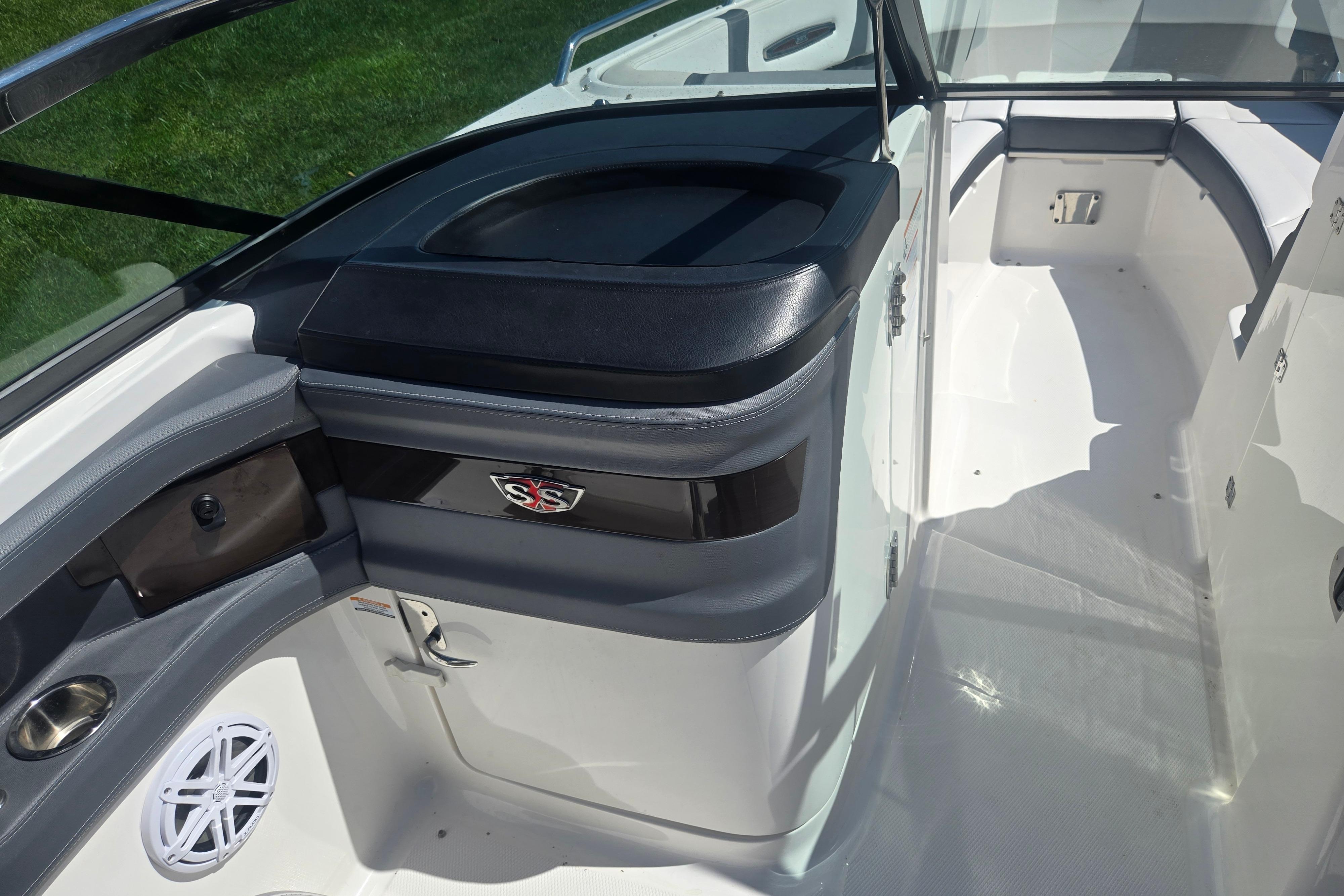 2018 Chaparral 267 SSX boat interior with seating and storage compartments.