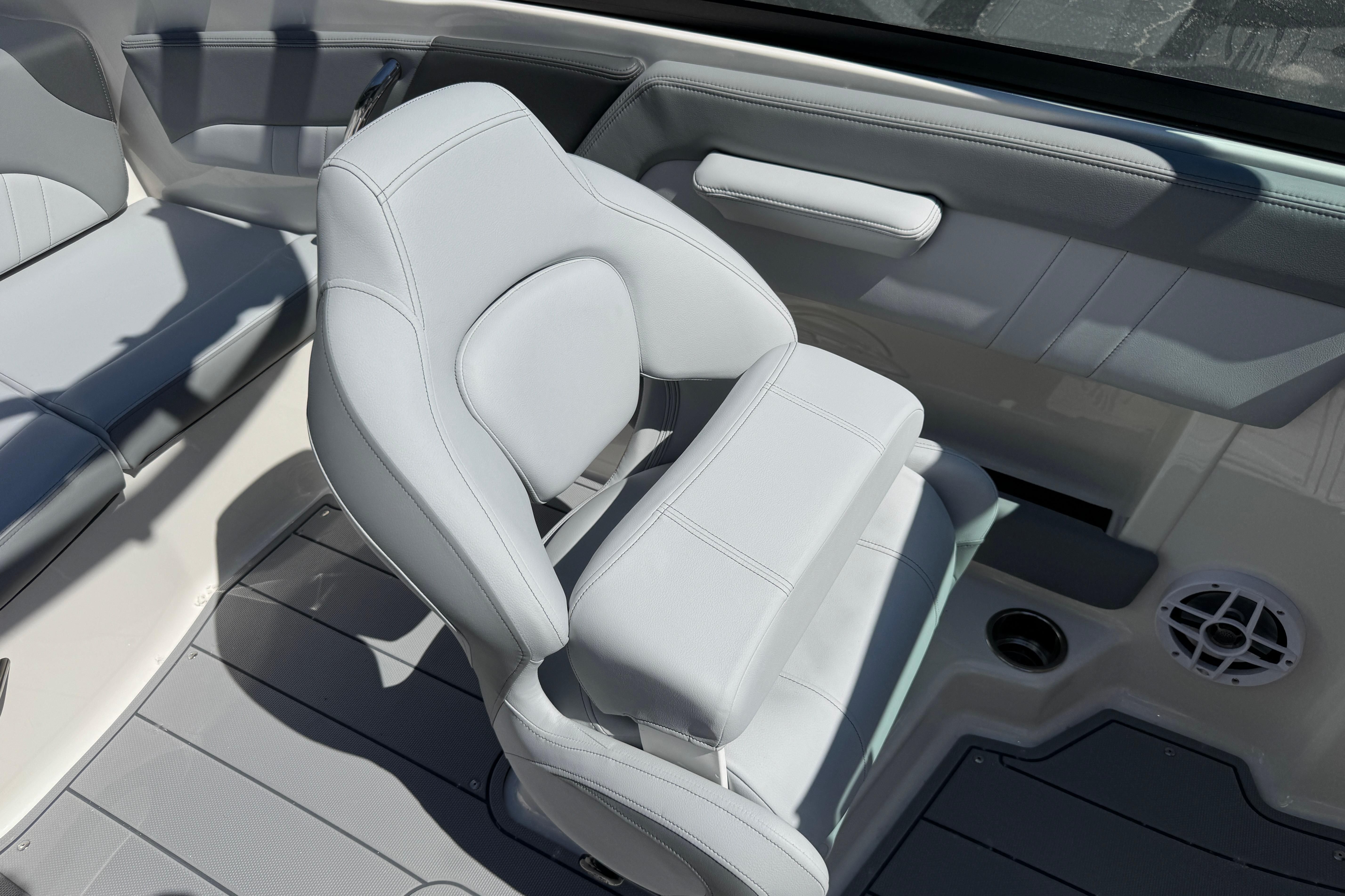 2026 Chaparral 21 SSi boat interior with sleek, modern seating and speaker detail.