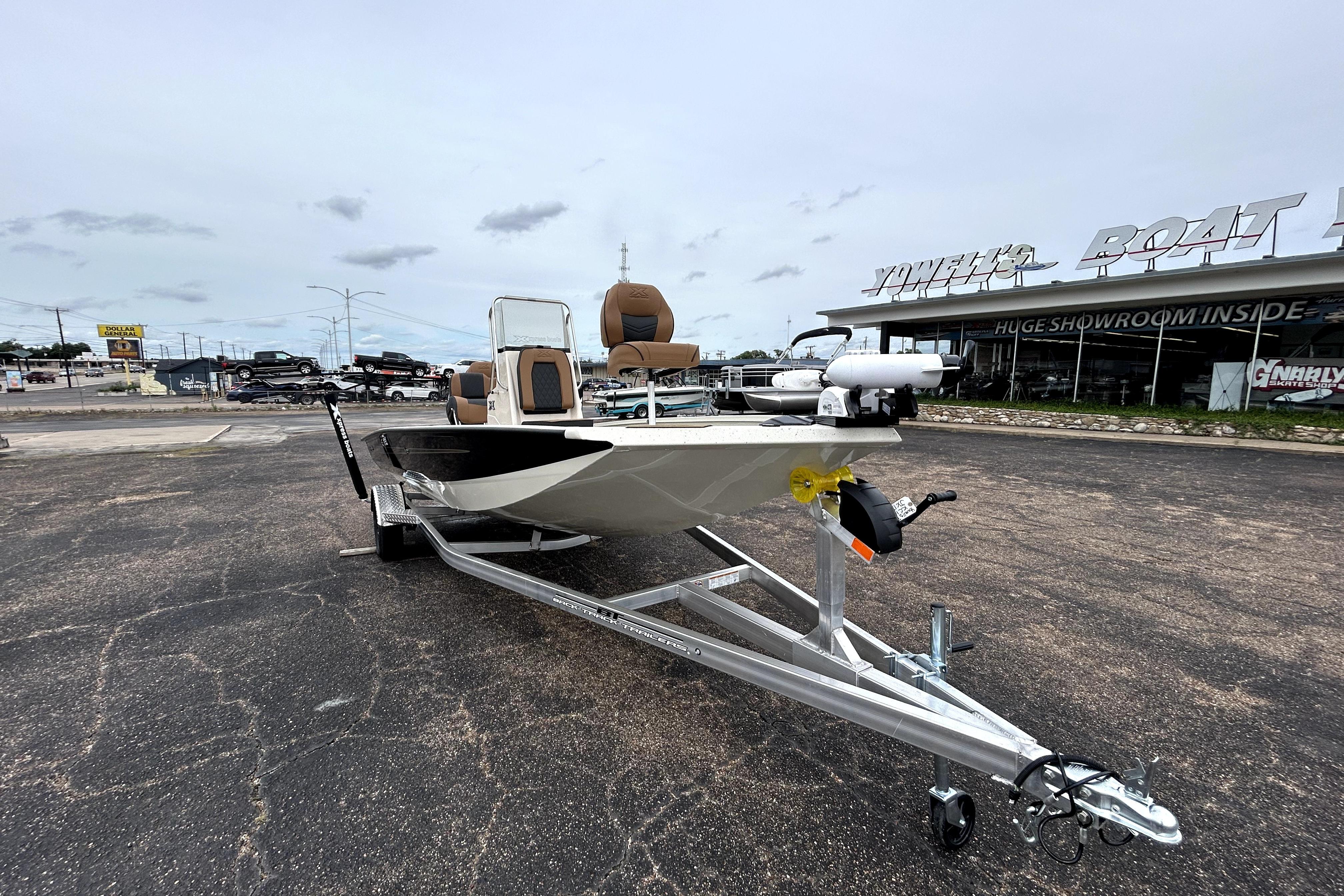 2026 Xpress H20B Bay boat on trailer outside showroom.