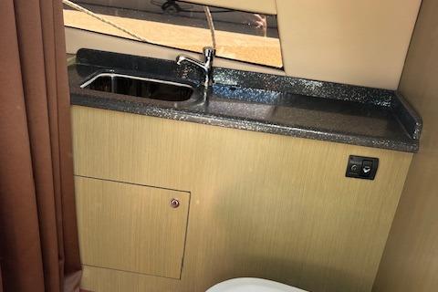 2024 Bracewell 25 boat interior with sink and countertop.