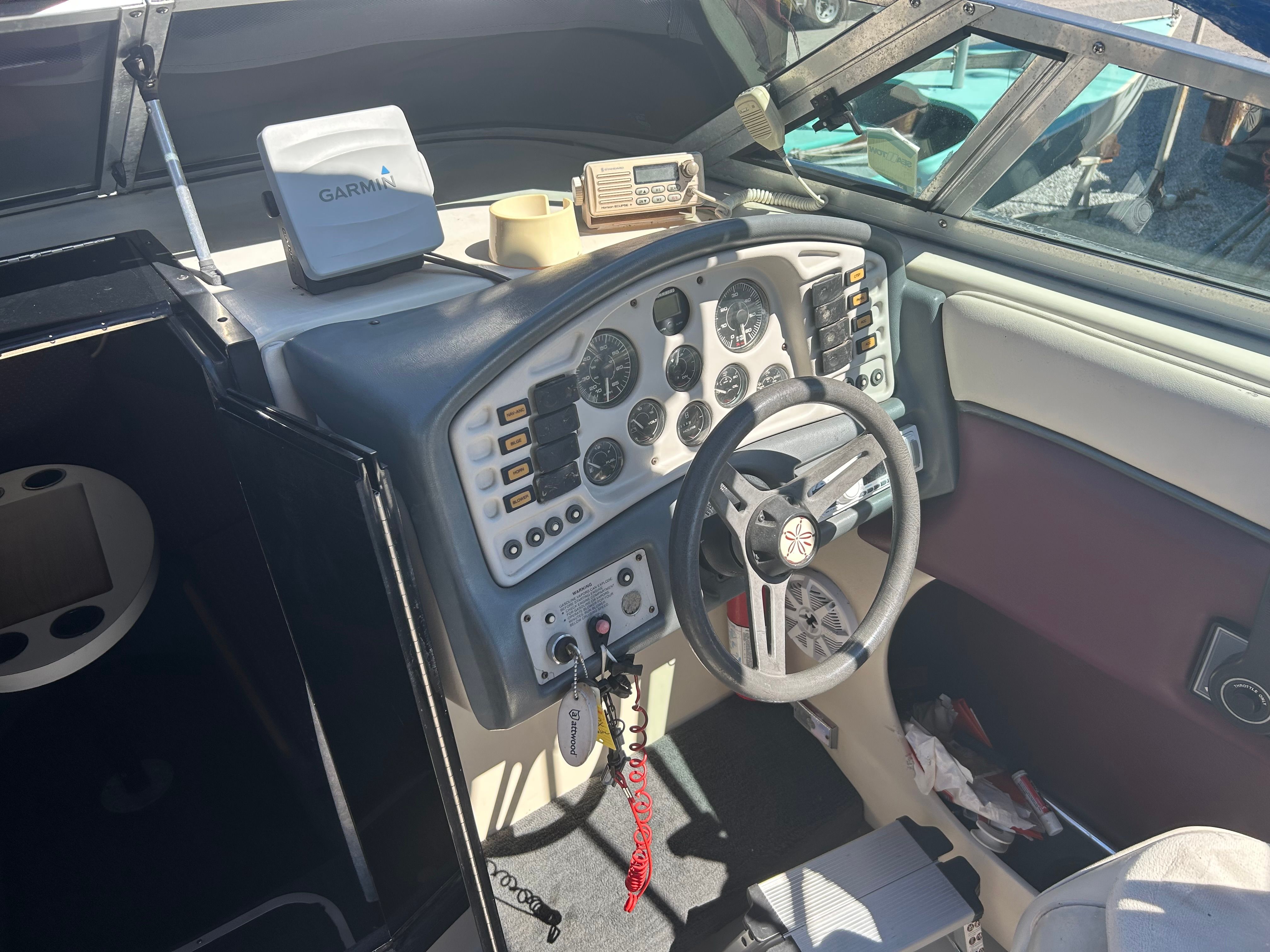 The cockpit of a 1992 Crownline Cudy Cruser with steering wheel and instrument panel.