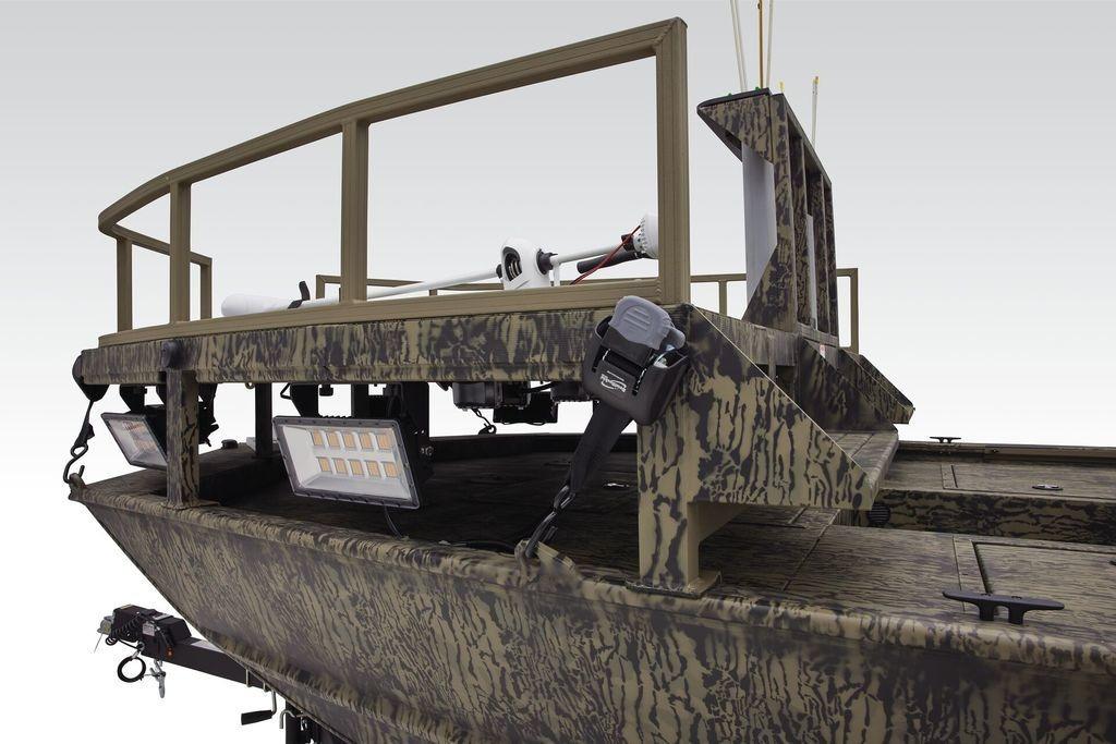 2026 Tracker GRIZZLY® 2072 CC Sportsman boat with camouflage design and mounted lights.