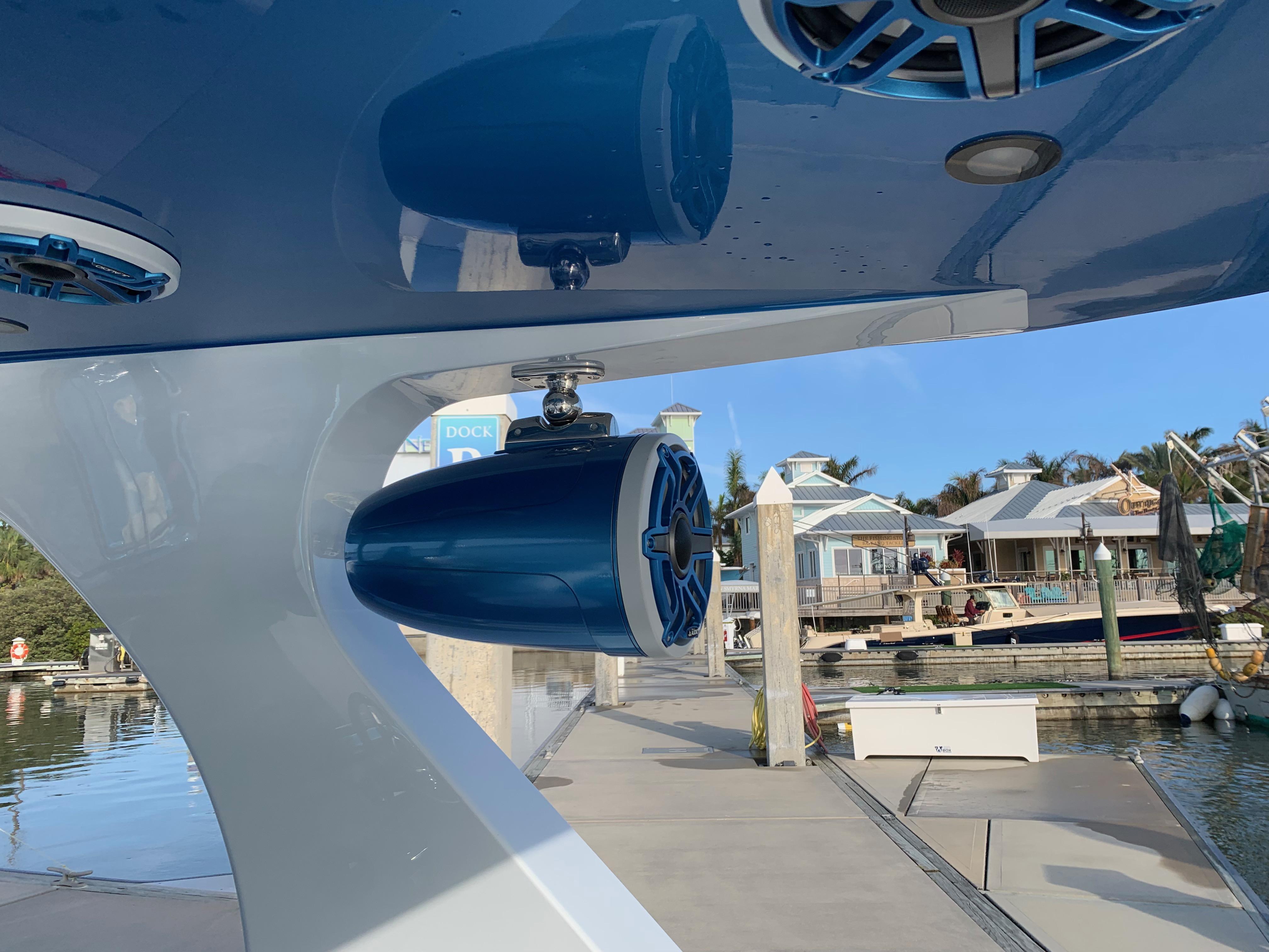 2023 Mystic Powerboats M3800 speaker system at a marina dock.
