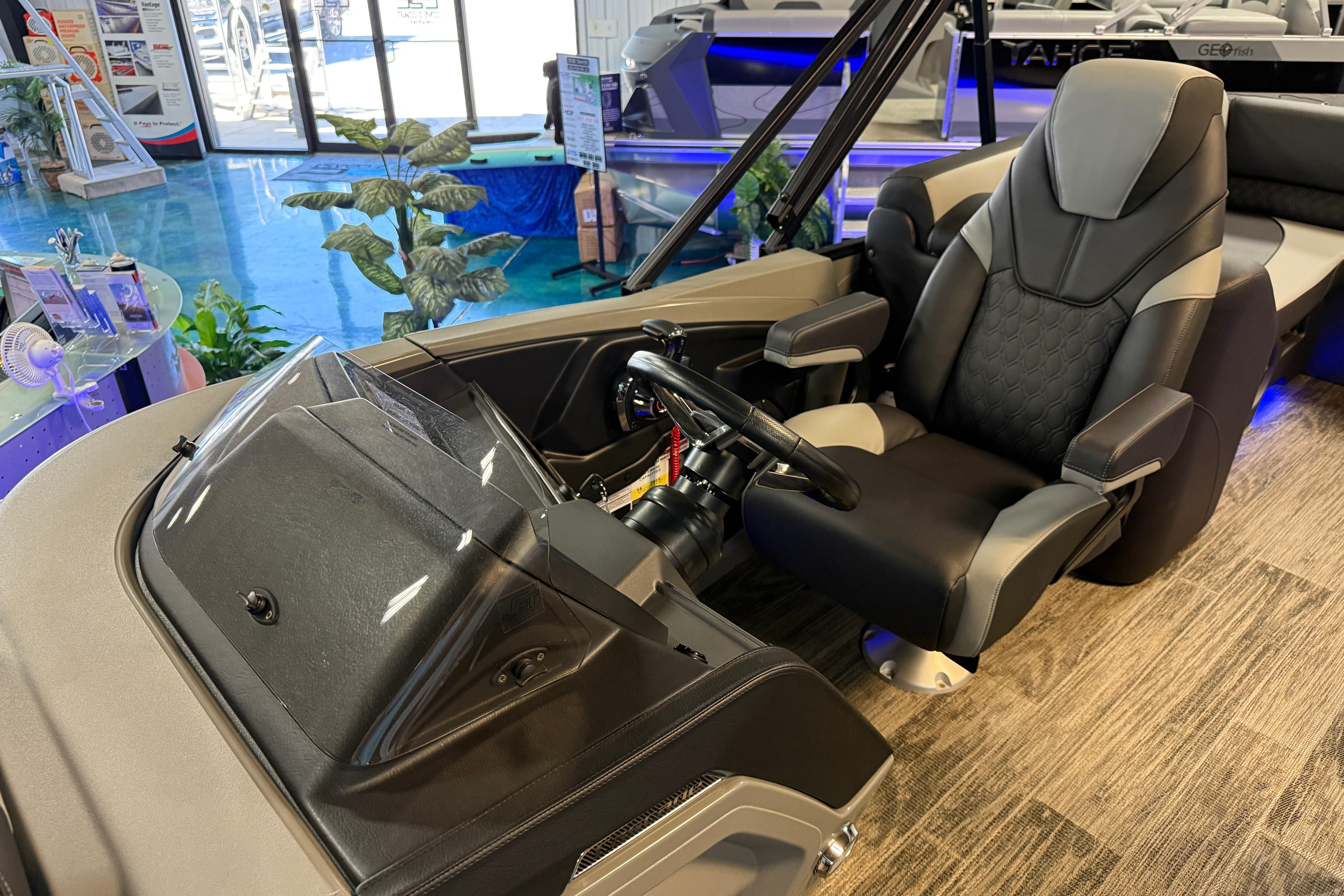 2026 Tahoe Pontoon Cascade Cruise Rear Bench interior with captain's chair and steering console.
