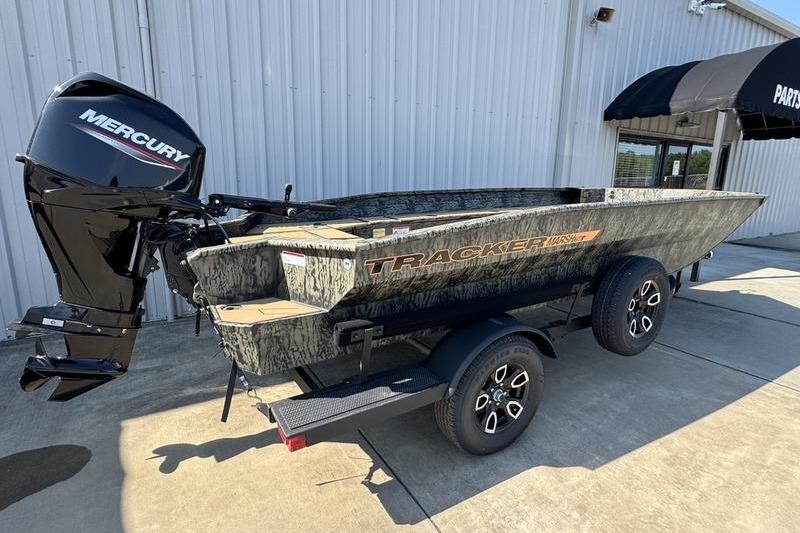 2026 Tracker Grizzly 1756 T Marsh boat on trailer, featuring Mercury outboard motor.