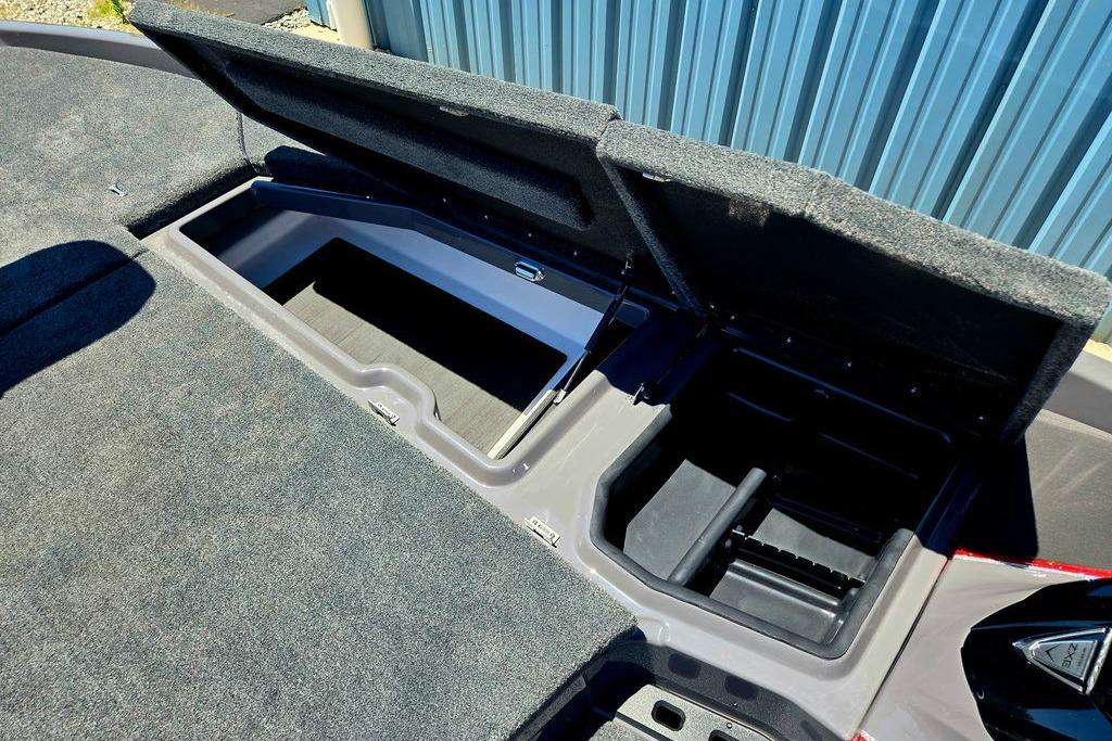 Open storage compartments on a 2026 Skeeter ZXE20 boat, showcasing ample space and design.