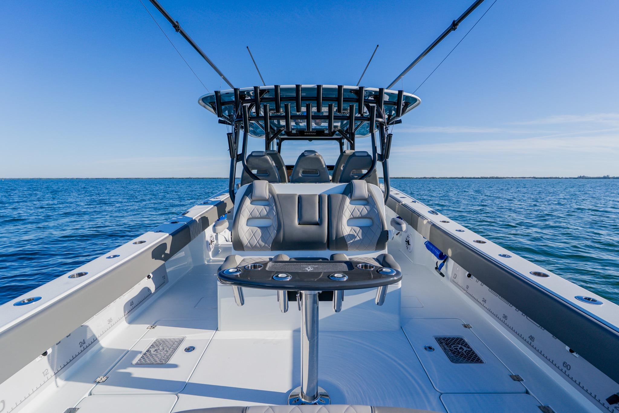 Freeman 42LR 2025 boat interior with seating, ocean view, and clear blue sky.