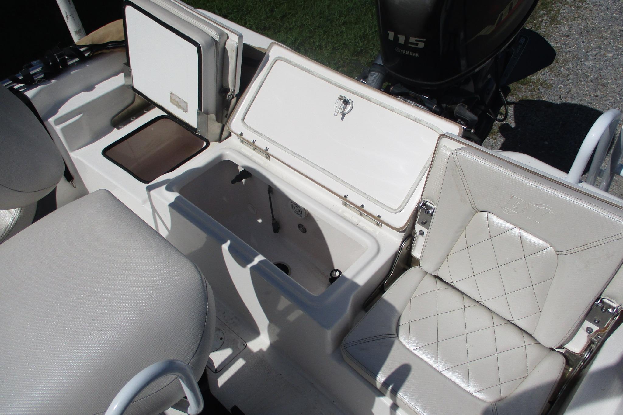 2021 Blue Wave 2000 PureBay boat interior with open storage compartments and seating.
