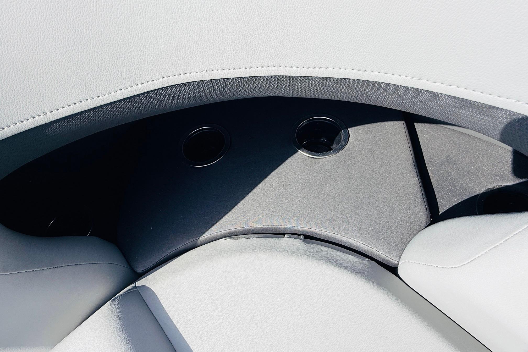 Interior seating of 2026 Sun Tracker SportFish 22 DLX with cup holders.