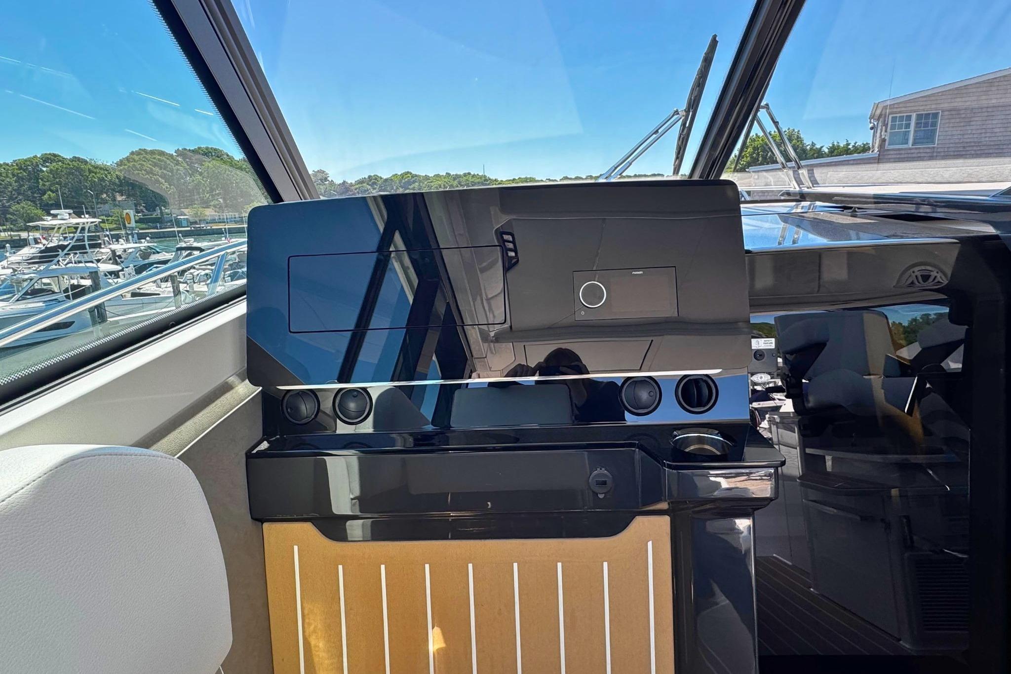 Interior helm of 2027 Tiara Yachts 39 LE, featuring sleek controls and modern design.