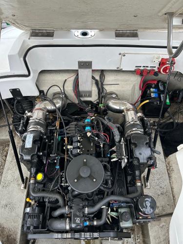 2010 Cobalt 262 boat engine compartment with visible wiring and components.