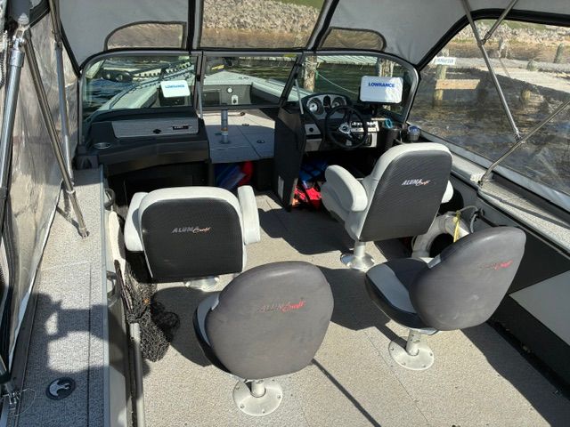 Interior of a 2016 Alumacraft Trophy 205 Sport boat with four seats.