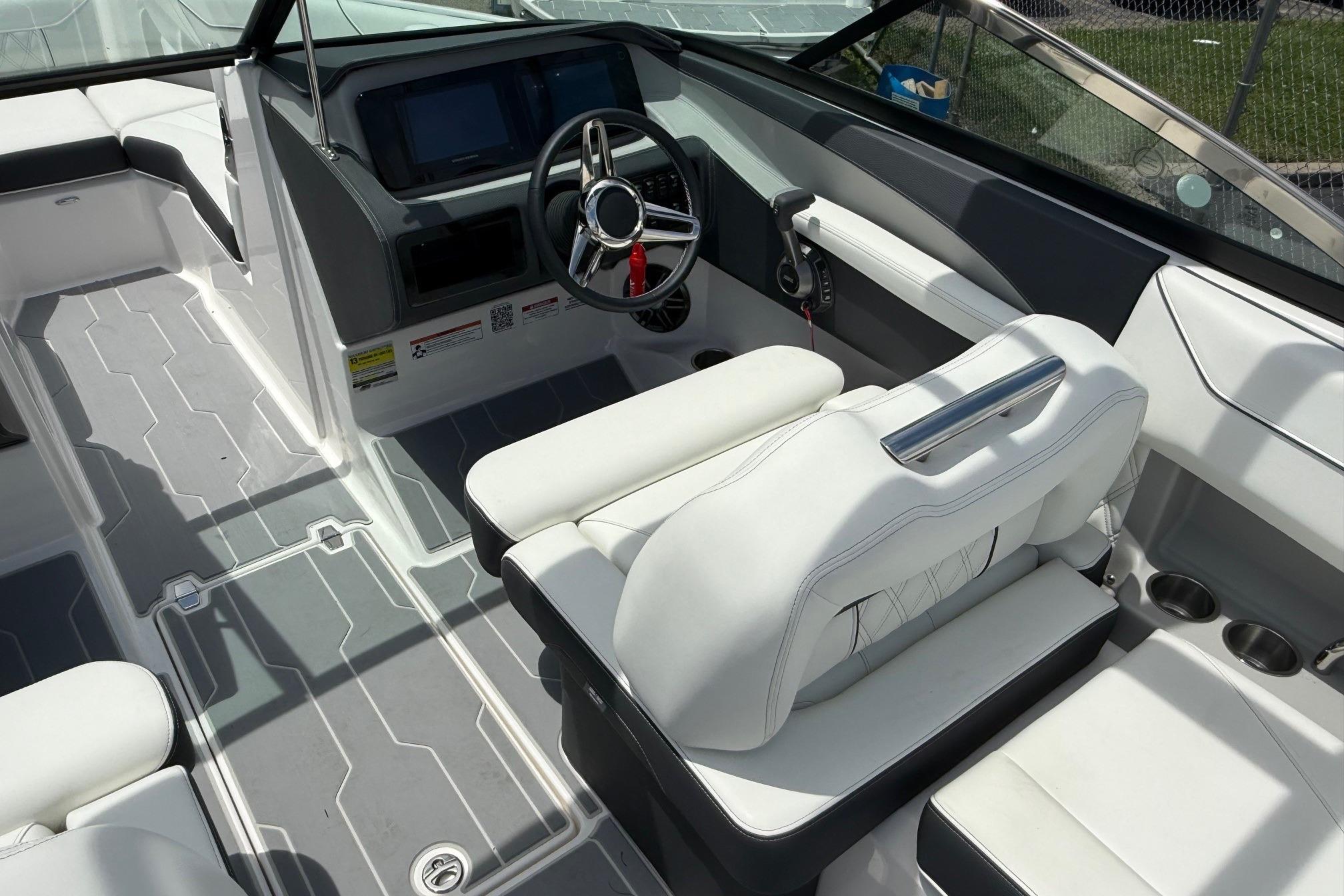 2026 Regal LS4 Surf boat interior with modern dashboard and white seating.