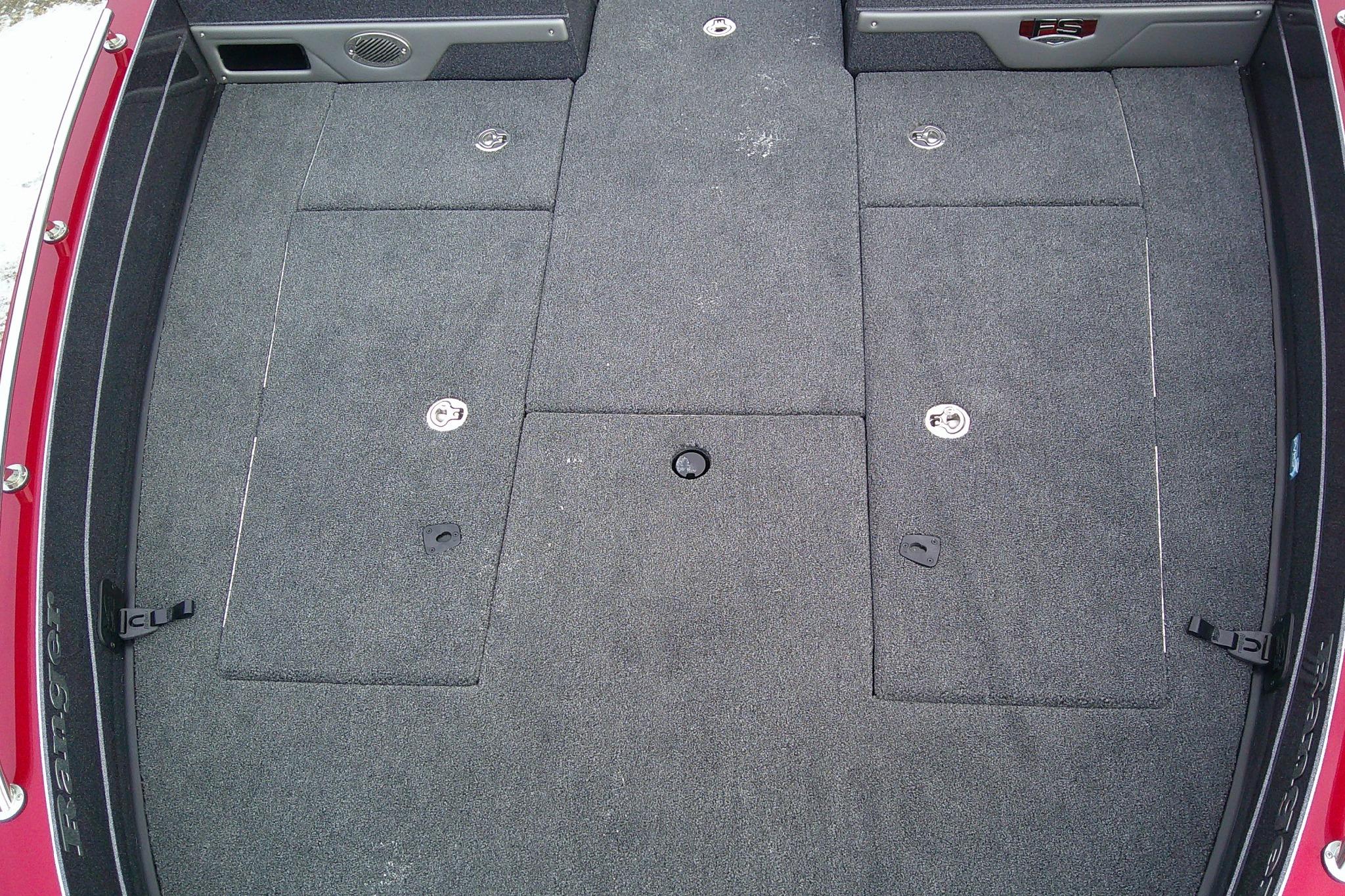 2026 Ranger 620FS Cup Equipped boat interior with carpeted storage compartments.
