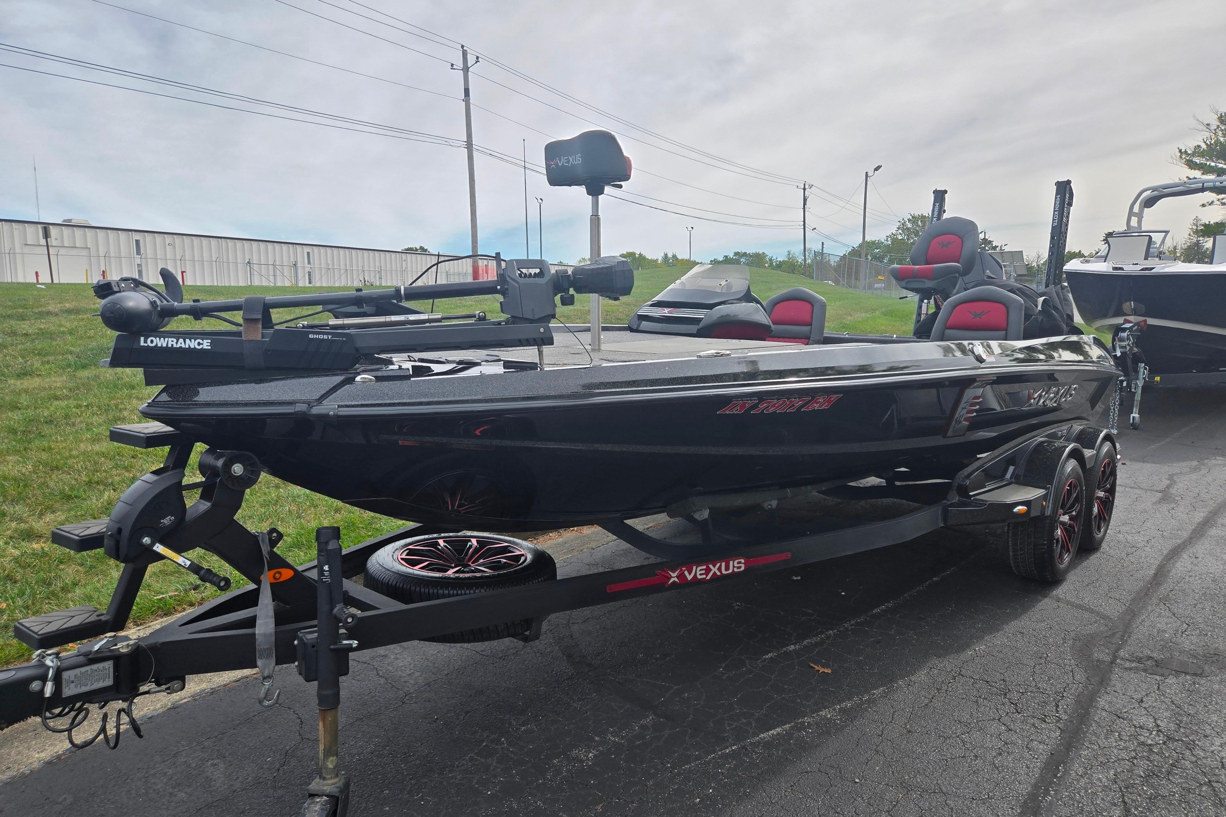 2022 Vexus VX20 boat on trailer, featuring Lowrance equipment, parked outdoors.