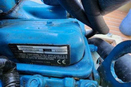 1985 Wasque Down East Cruiser engine, blue components, close-up view.