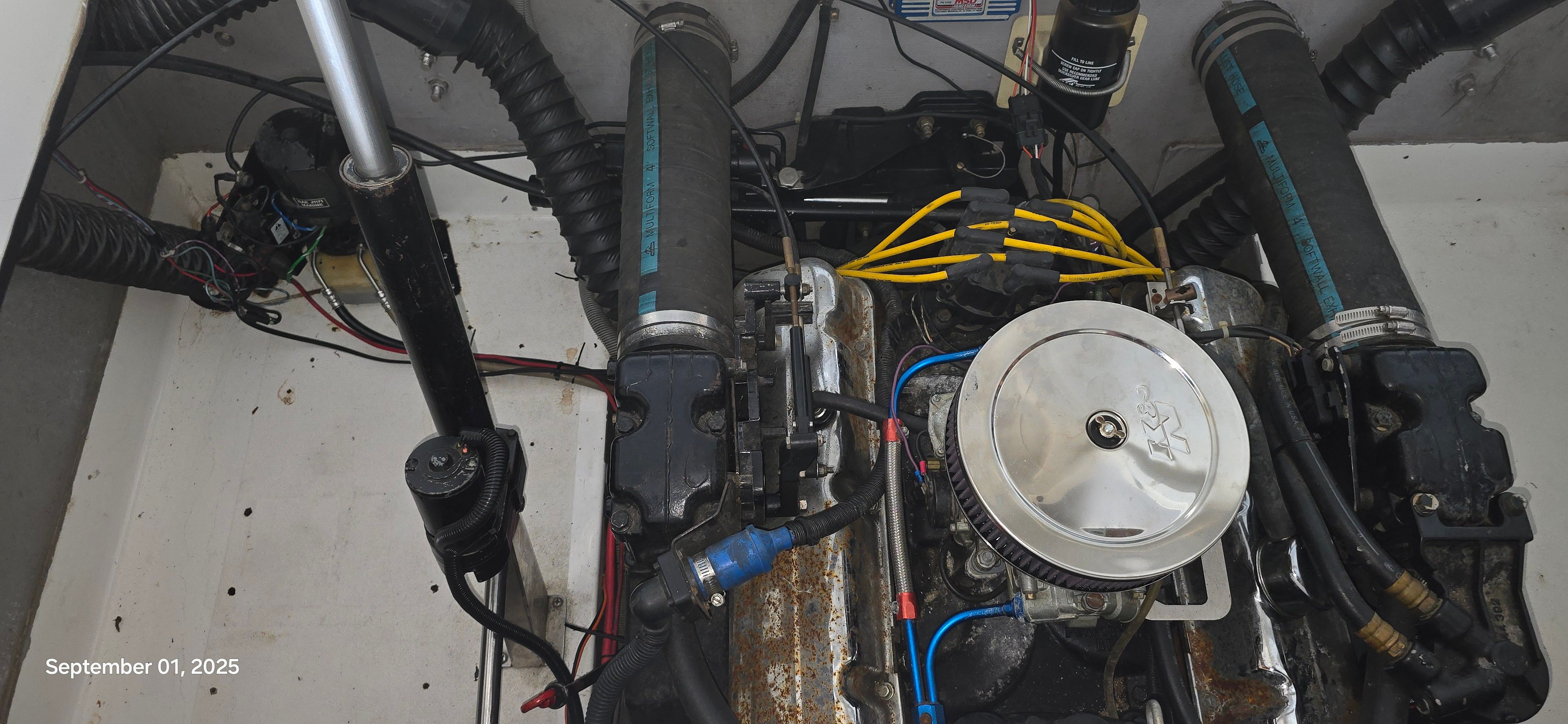 Engine compartment of a 1989 Baja FORCE 235 with visible engine and wiring components.