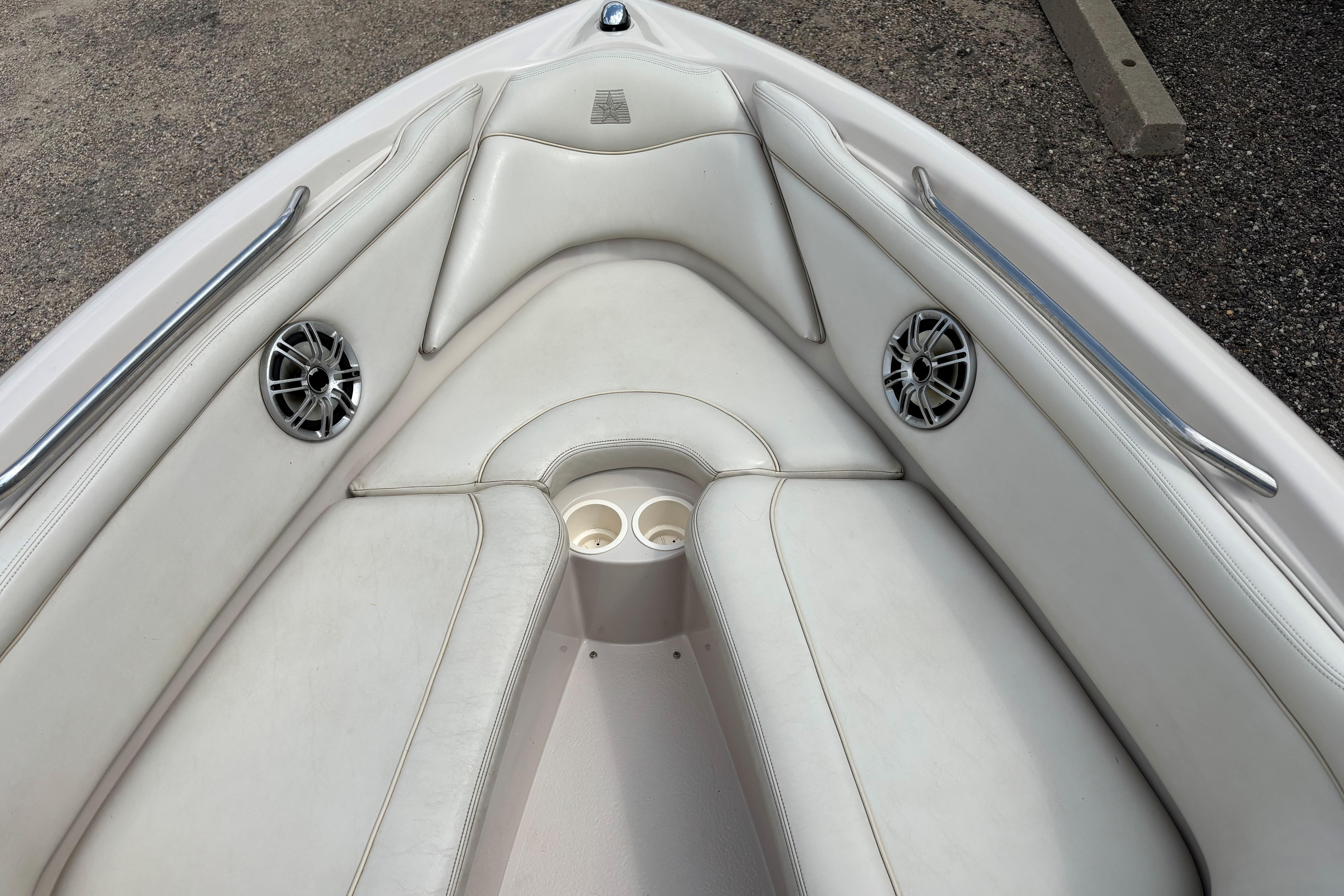 1999 MasterCraft 205 PRO STAR boat interior with white seating and speakers.