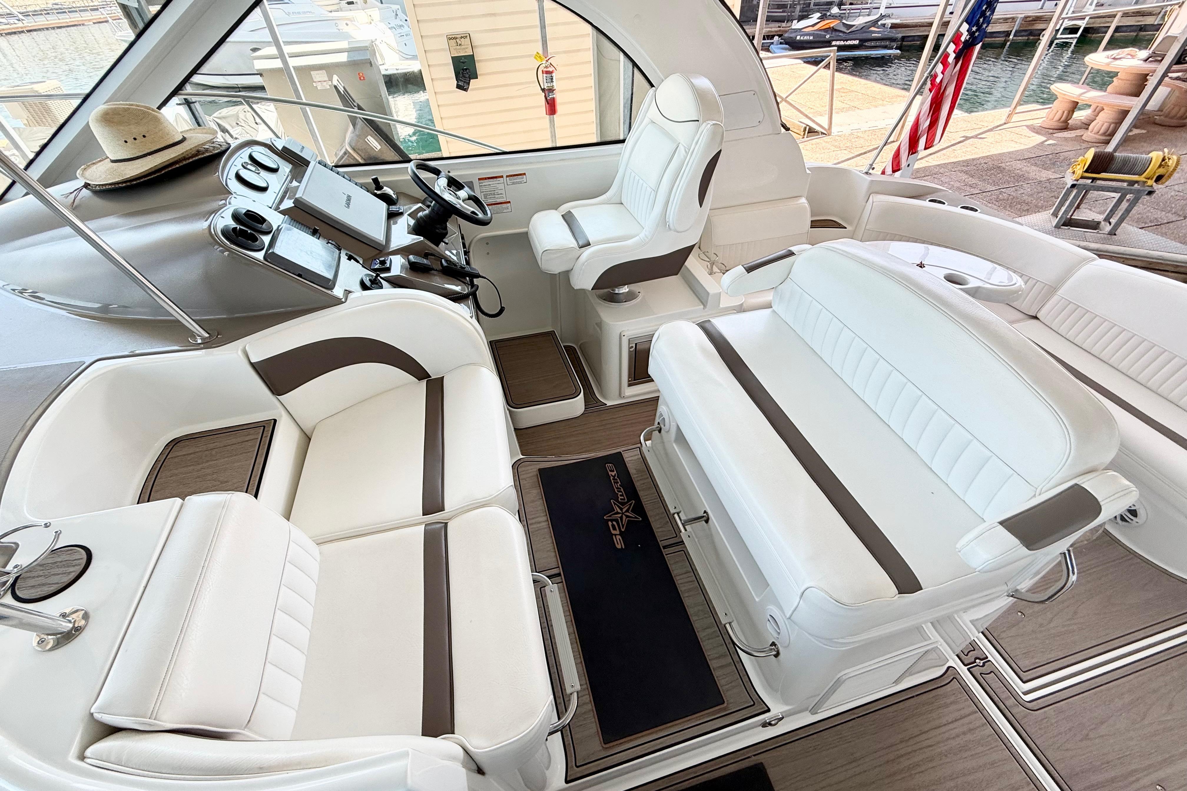 Luxurious 2011 Cruisers Yachts 390 Sports Coupe interior with plush white seating.