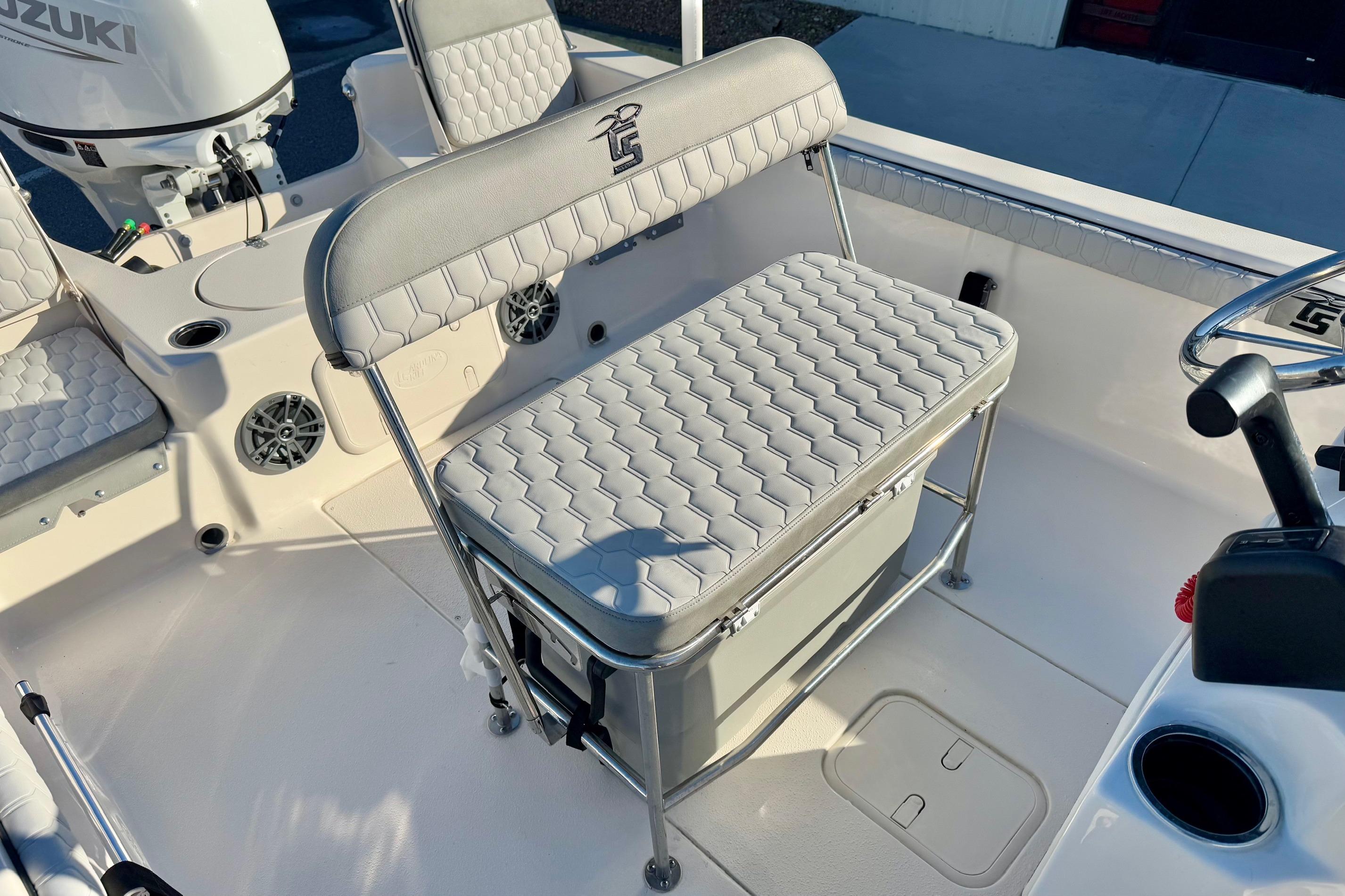2025 Carolina Skiff 21 LS boat interior with cushioned seating and storage.