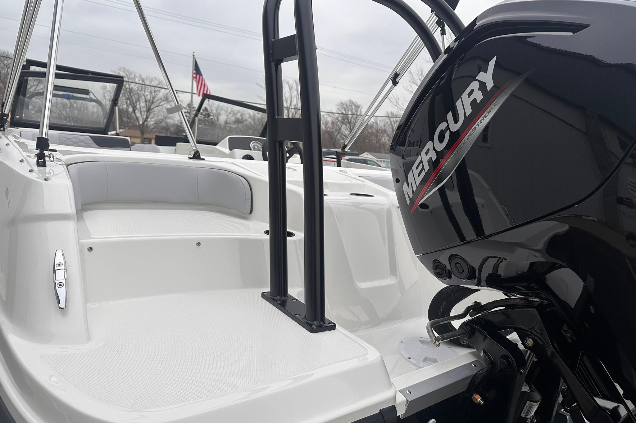 2026 Bayliner M17 boat with Mercury engine, featuring sleek white interior design.