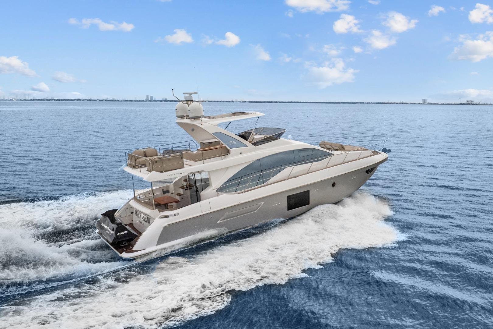 2019 Azimut 55 yacht cruising on open water under a clear blue sky.
