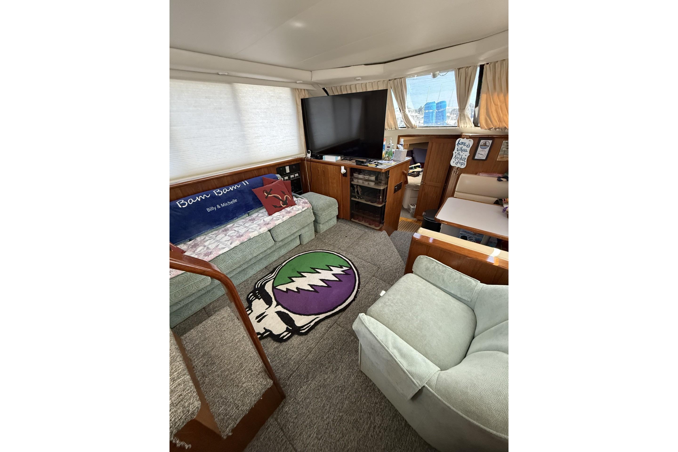 Interior of 1993 Carver 350 Motor Yacht with cozy seating and entertainment area.