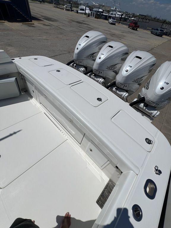 2021 Regulator 41 boat with four powerful outboard engines, docked at a marina.
