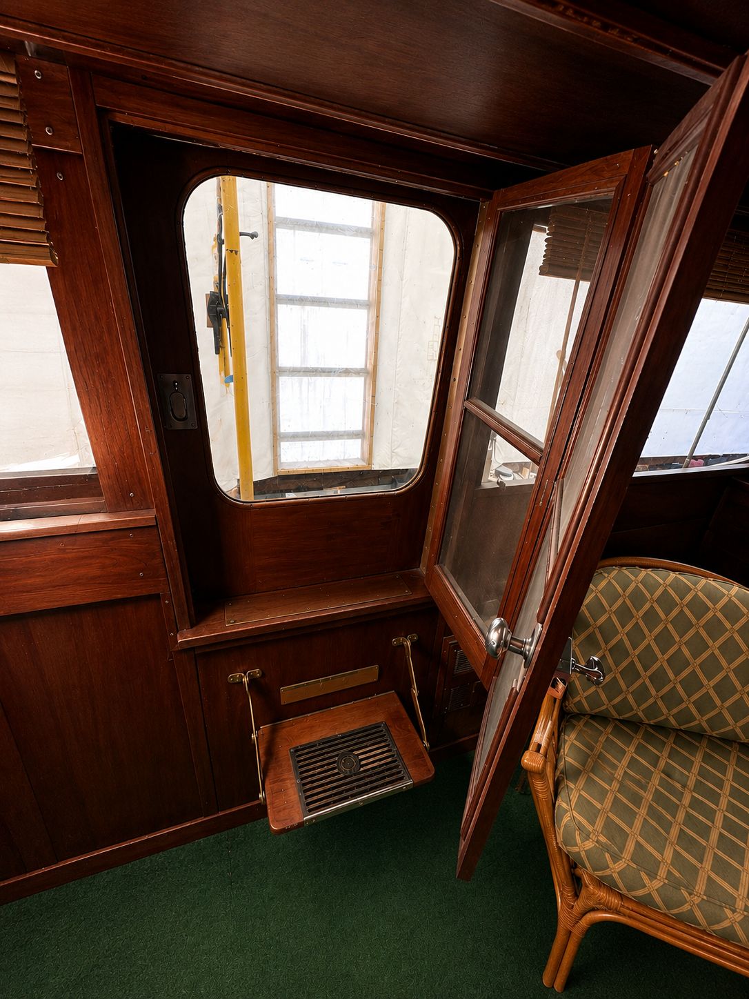 Interior of a 1951 Chris-Craft 50 Catalina yacht with wooden doors.