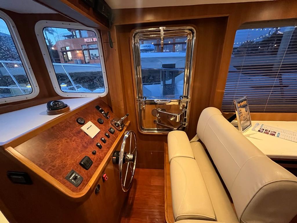 Interior of 2025 Bracewell 41 boat with steering wheel and control panel.