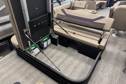 2026 Bennington 22SXSB pontoon boat interior with storage compartment and seating.