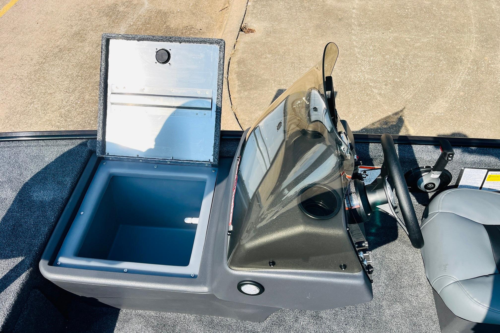 2026 Tracker Bass Tracker Classic XL boat interior with open storage compartment and steering console.