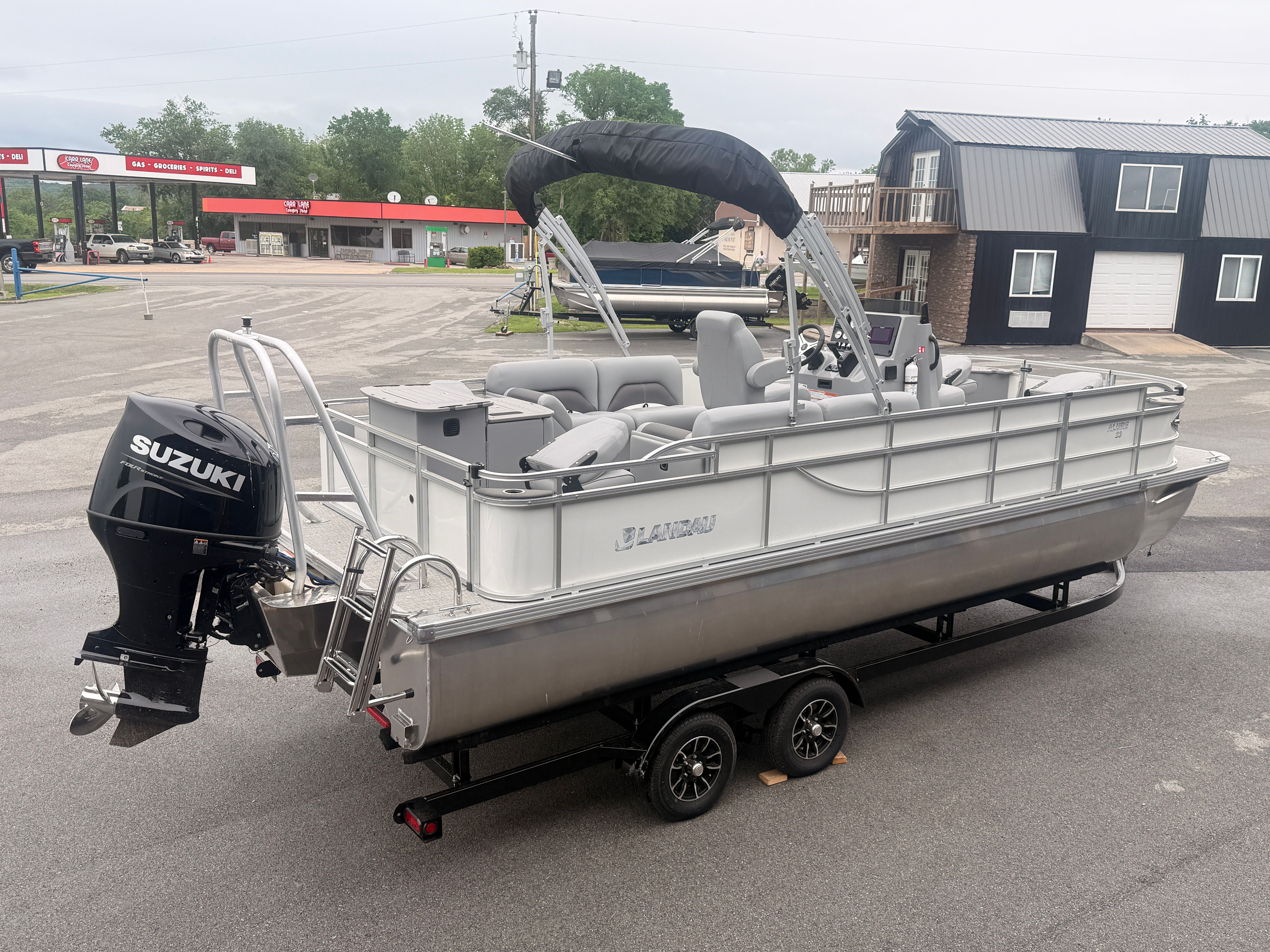 2026 Landau Alure 23CC Fish boat with Suzuki engine on trailer.