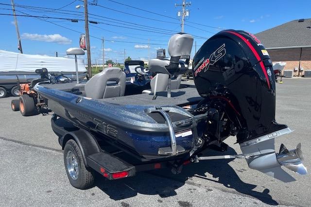 2026 Nitro Z18 Pro fishing boat with powerful outboard motor, parked on a trailer.