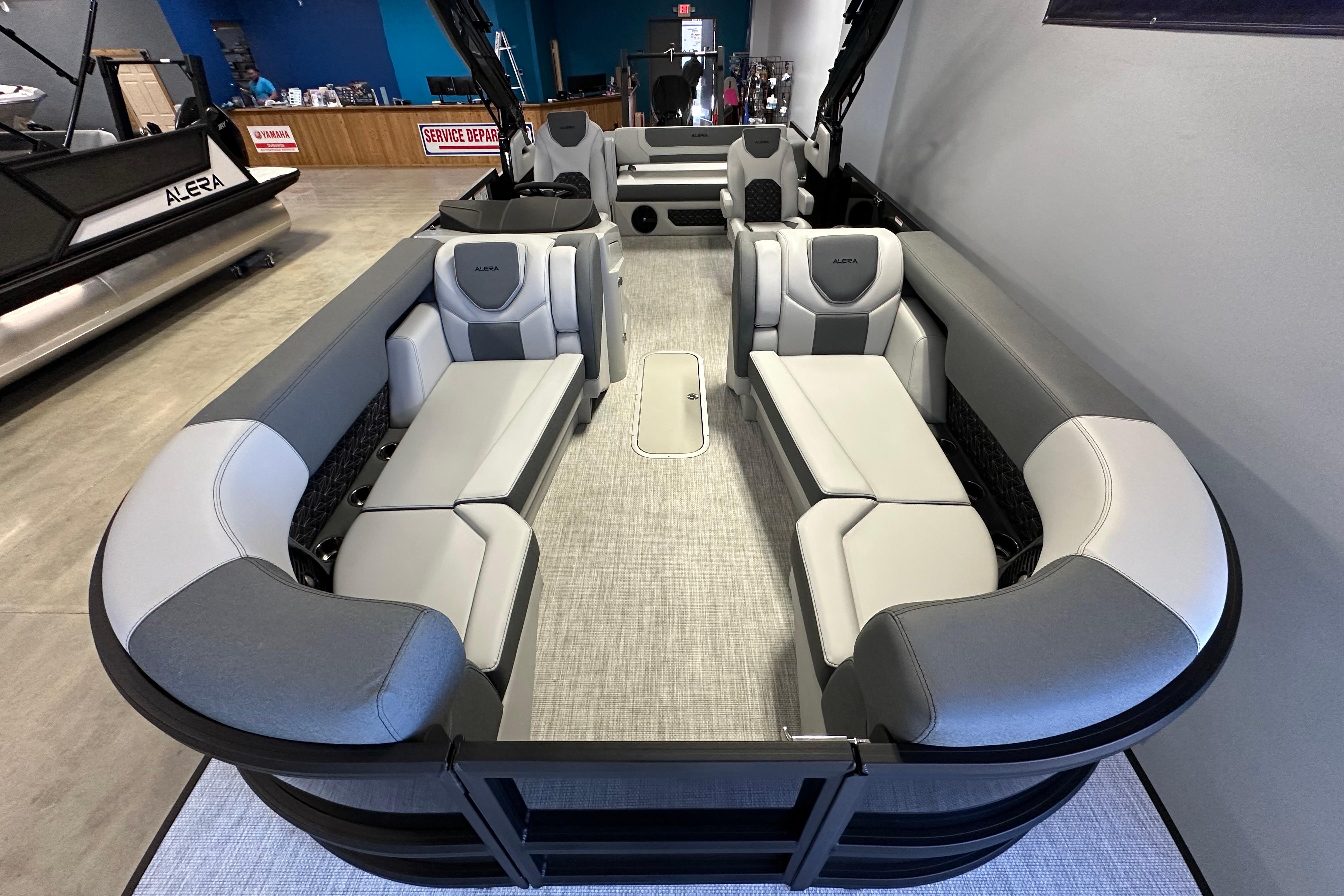 2026 Alera M25L pontoon boat interior with gray seating and modern design.