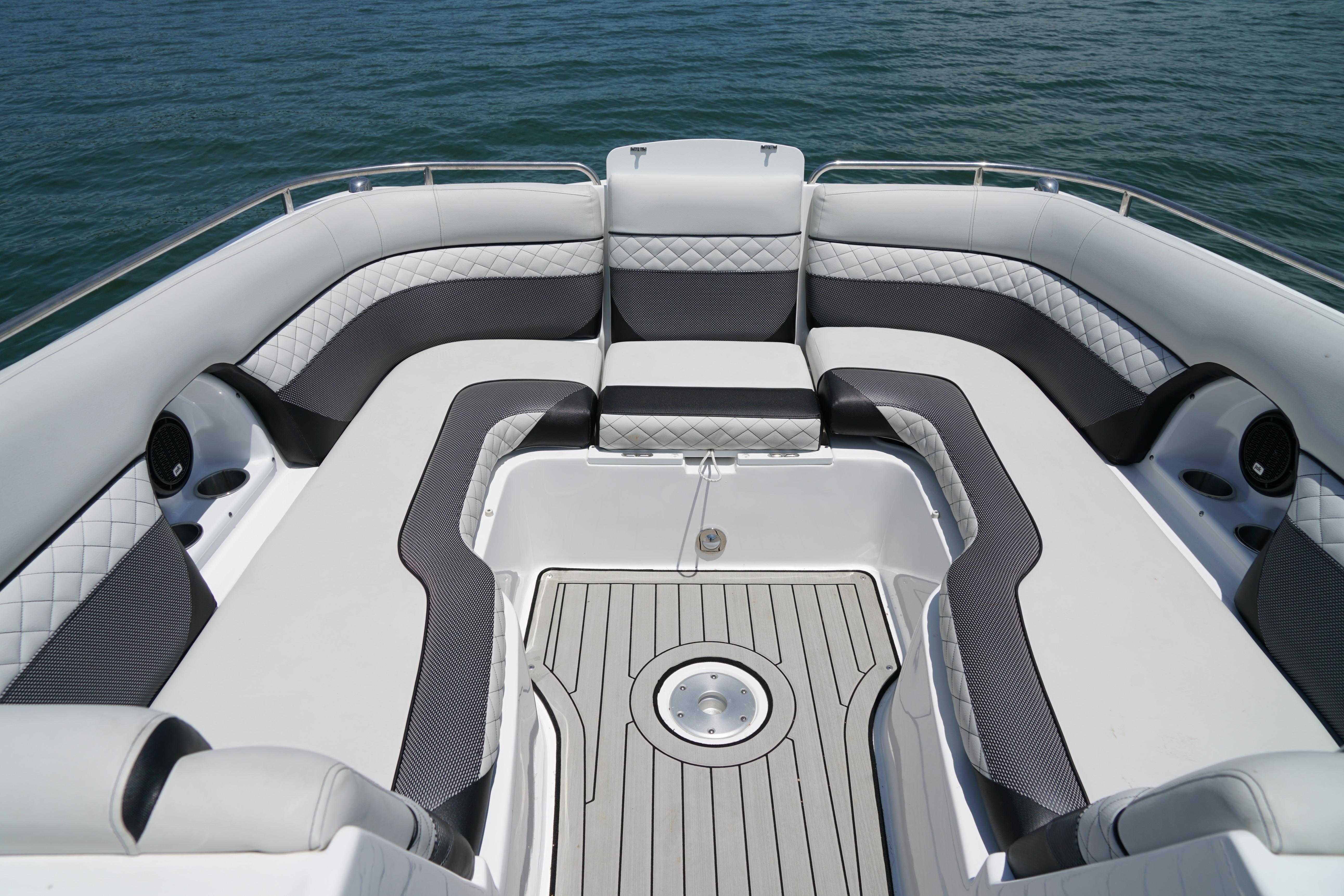 2020 Hurricane SunDeck 2486 OB boat interior with spacious seating and elegant design on the water.