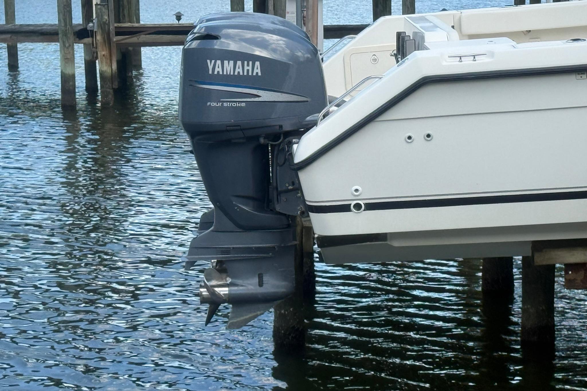 2003 Pursuit 2870 Walkaround with Yamaha four-stroke outboard motor on water.