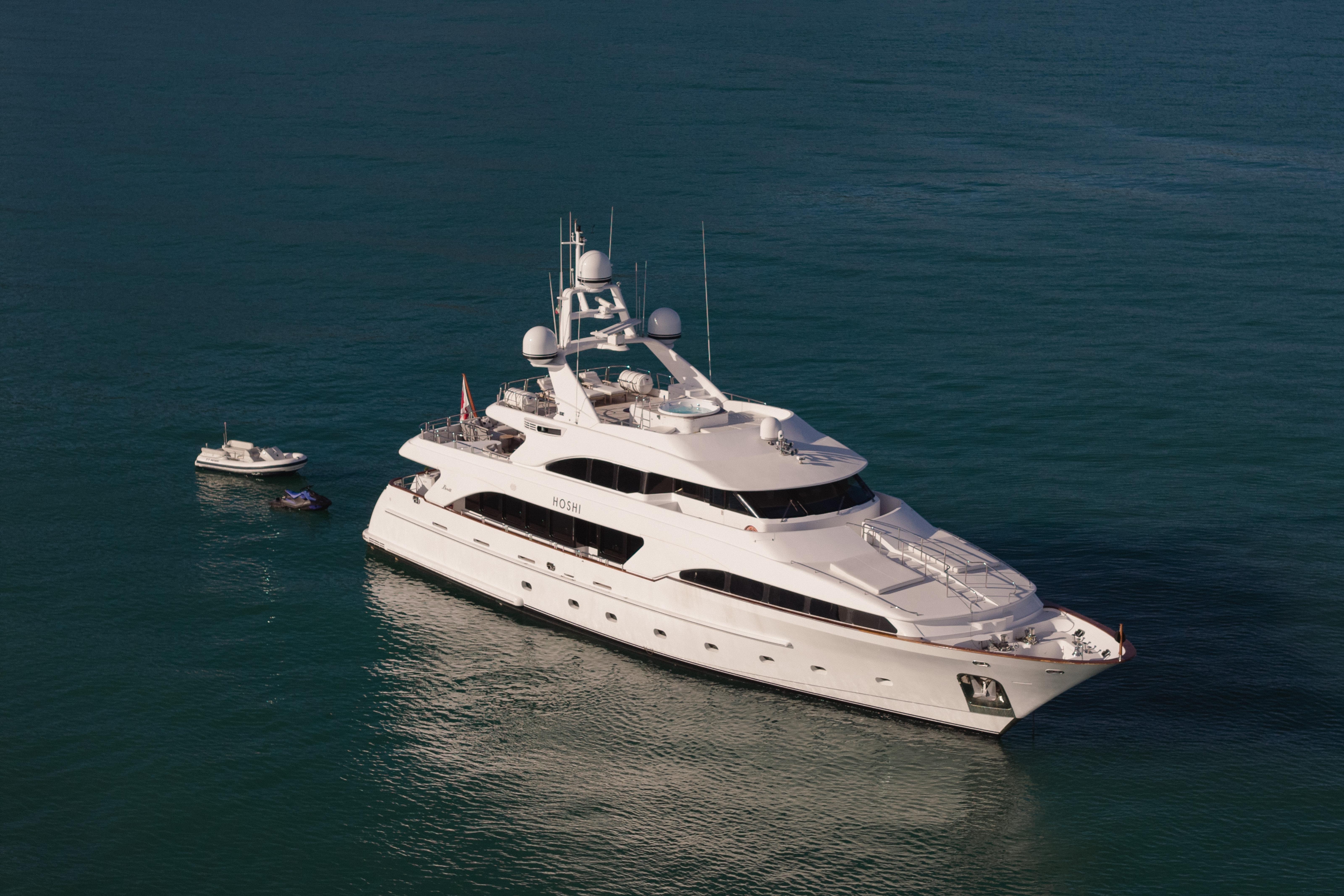 Luxurious 2000 Benetti Classic 115 yacht on serene blue waters.