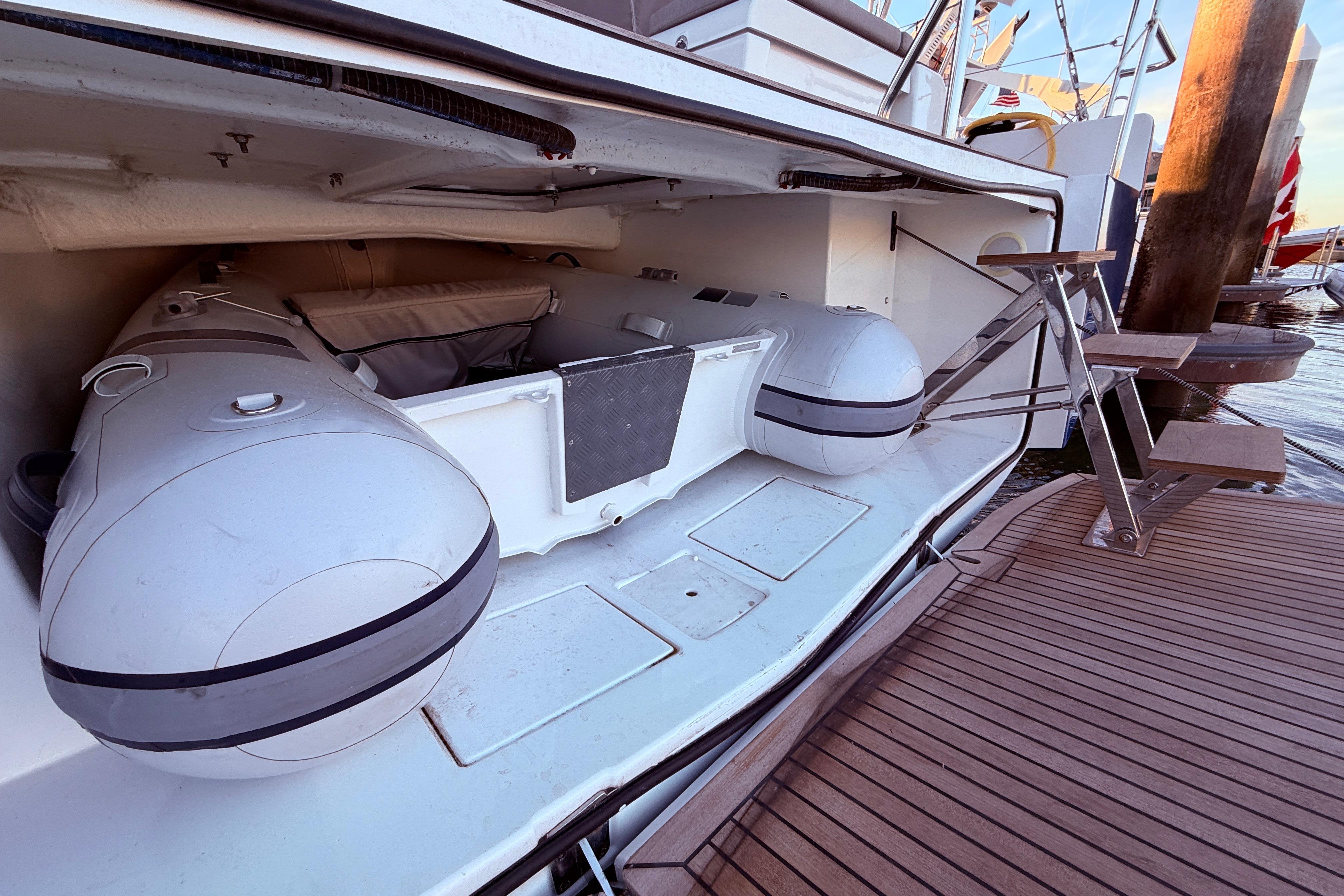 2022 Beneteau Oceanis Yacht 54 with inflatable tender in storage compartment.