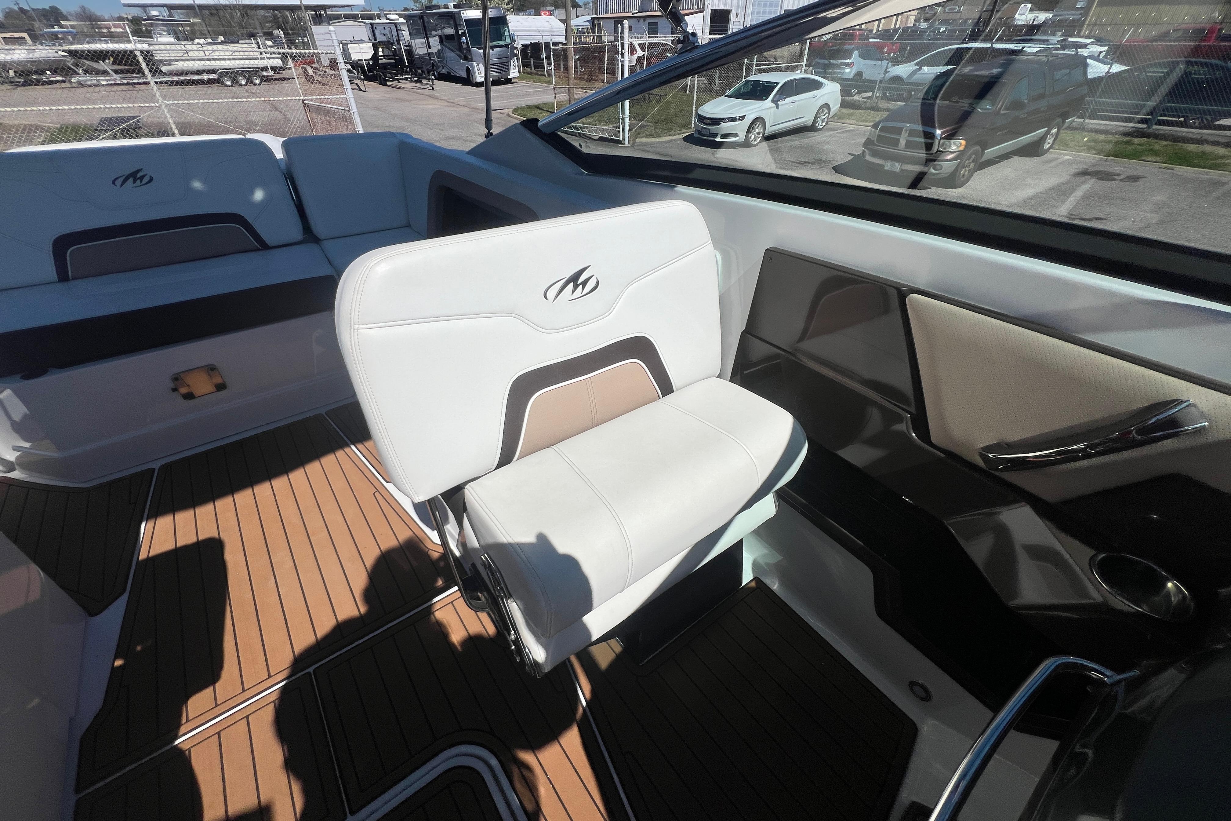 2017 Monterey 298SS Super Sport boat interior with white seating and wood flooring.